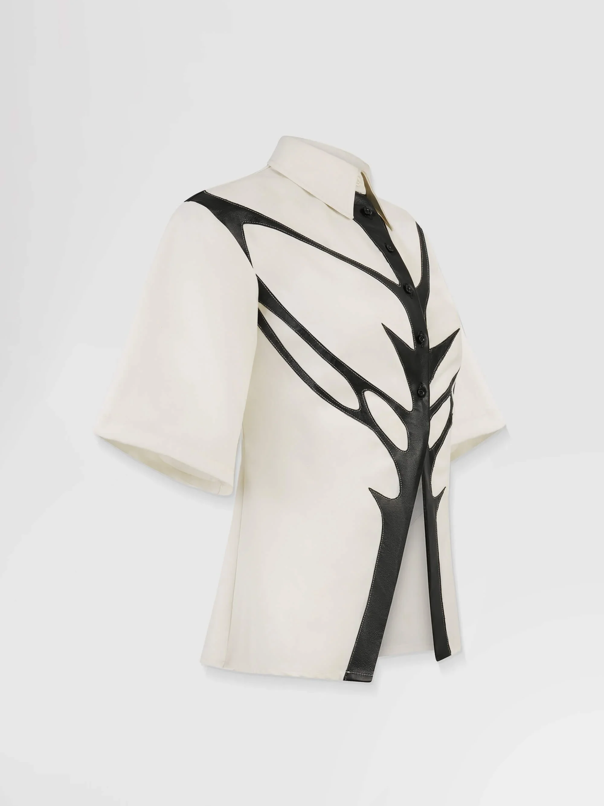 Side profile of the shirt, emphasizing the narrow, tailored fit.