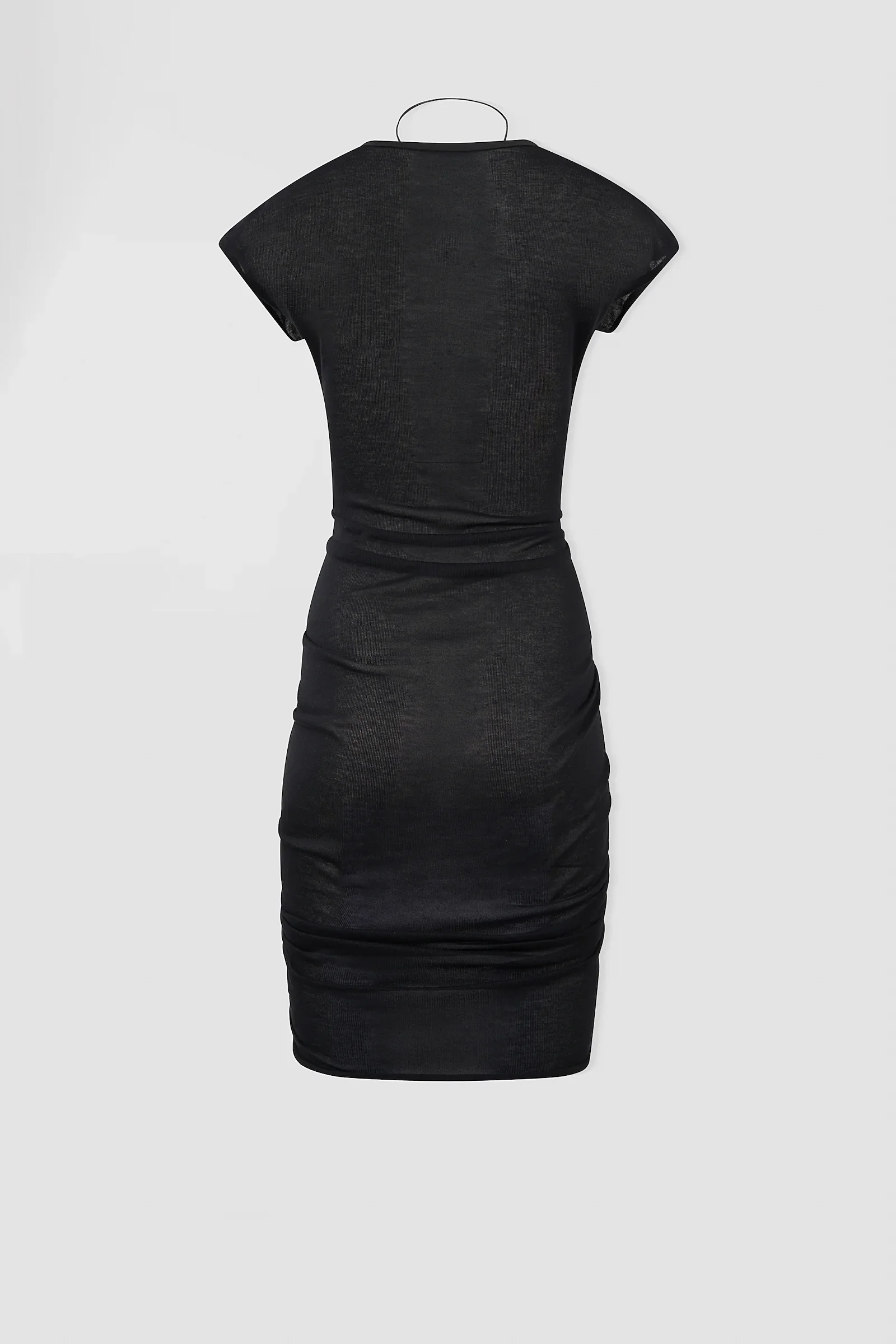Back: Back view of the ‘Medusa’ black jersey dress featuring its fitted silhouette and lightweight semi-sheer fabric.