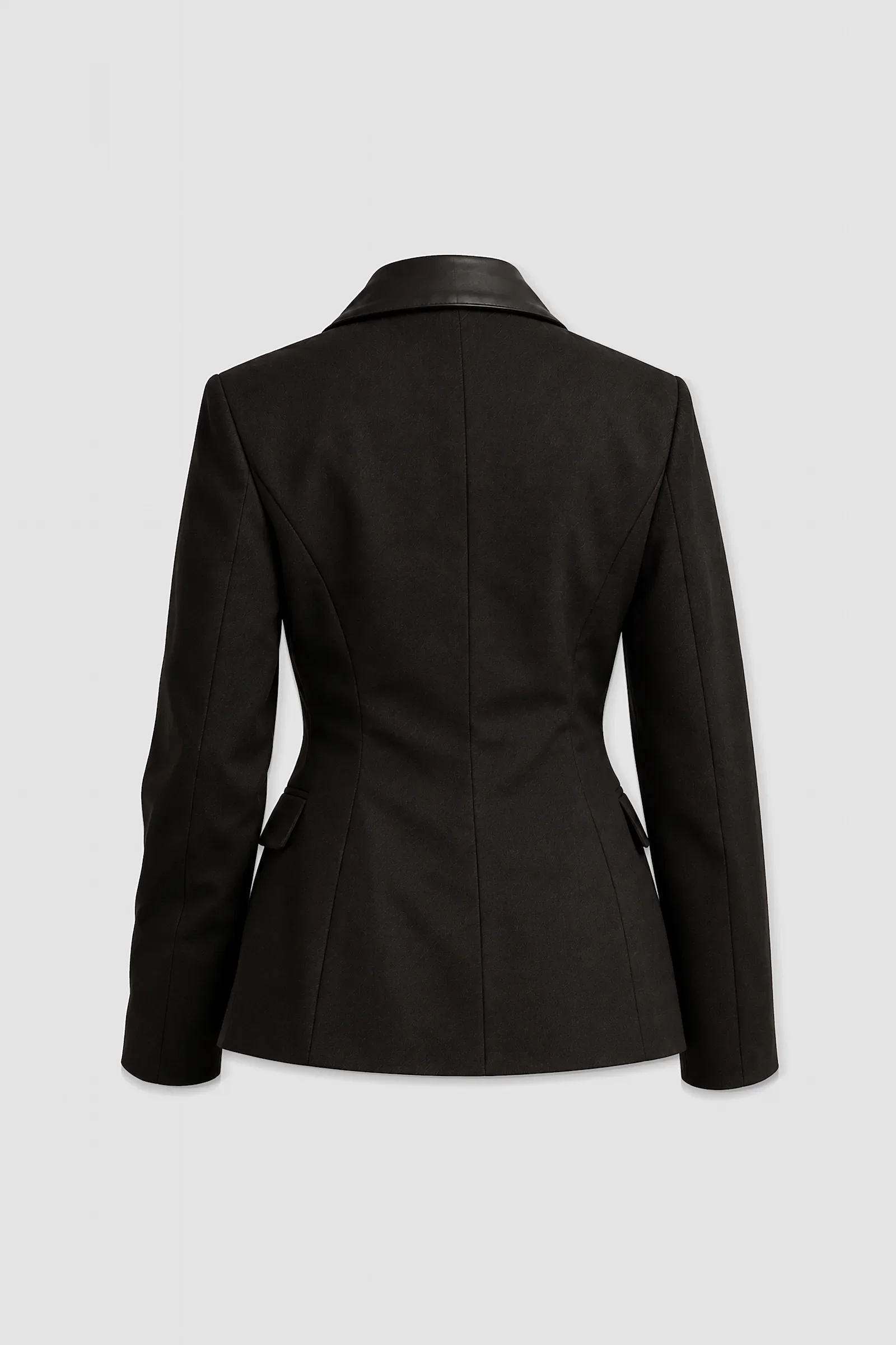 Three-quarter: Three-quarter view of the Stheno black tailored blazer showing structured shoulders, leather collar, notched lapels and fitted waist.