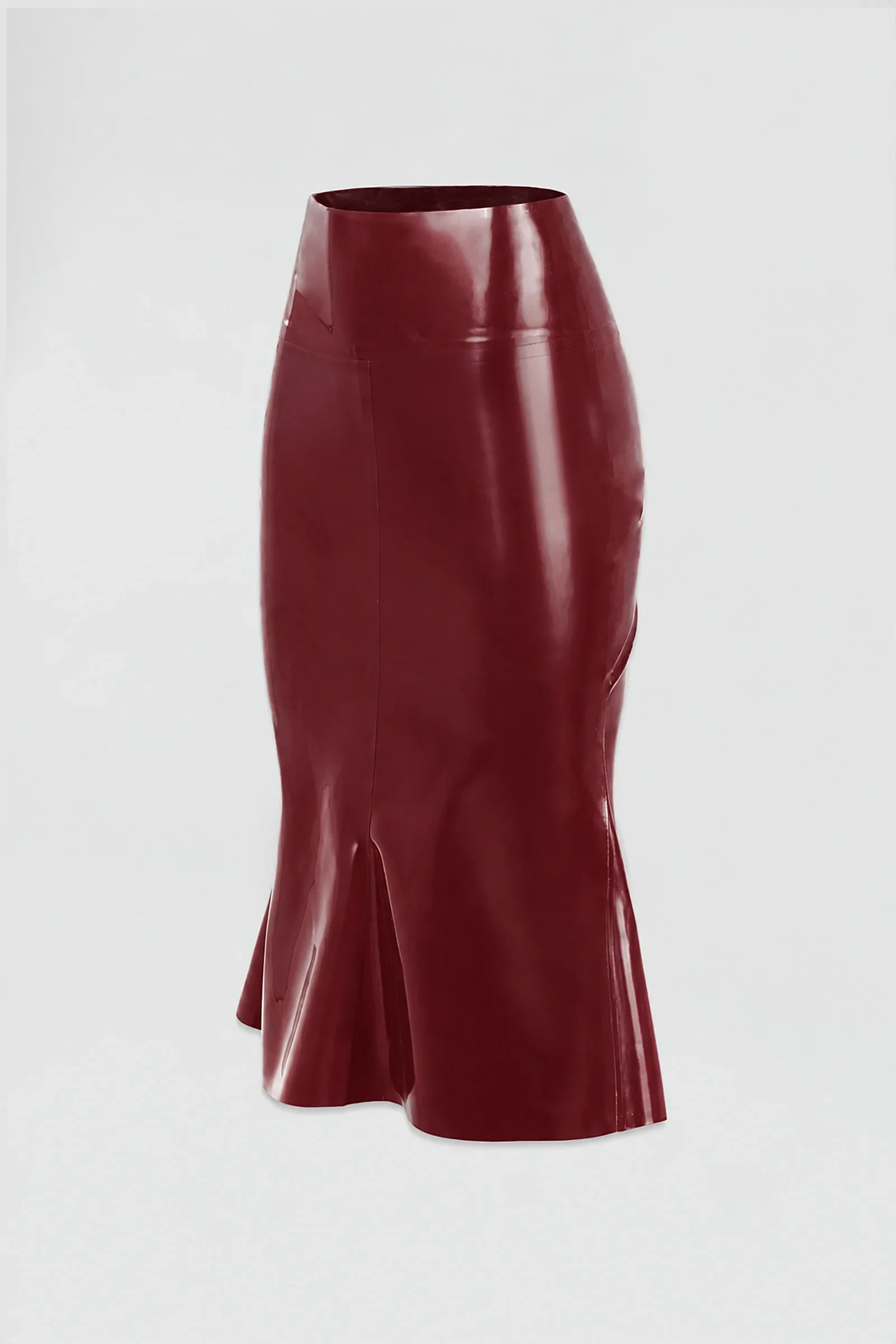 Side: Side view of the ‘Ophis’ latex skirt showing its body-contouring mermaid silhouette and flared lower panels.