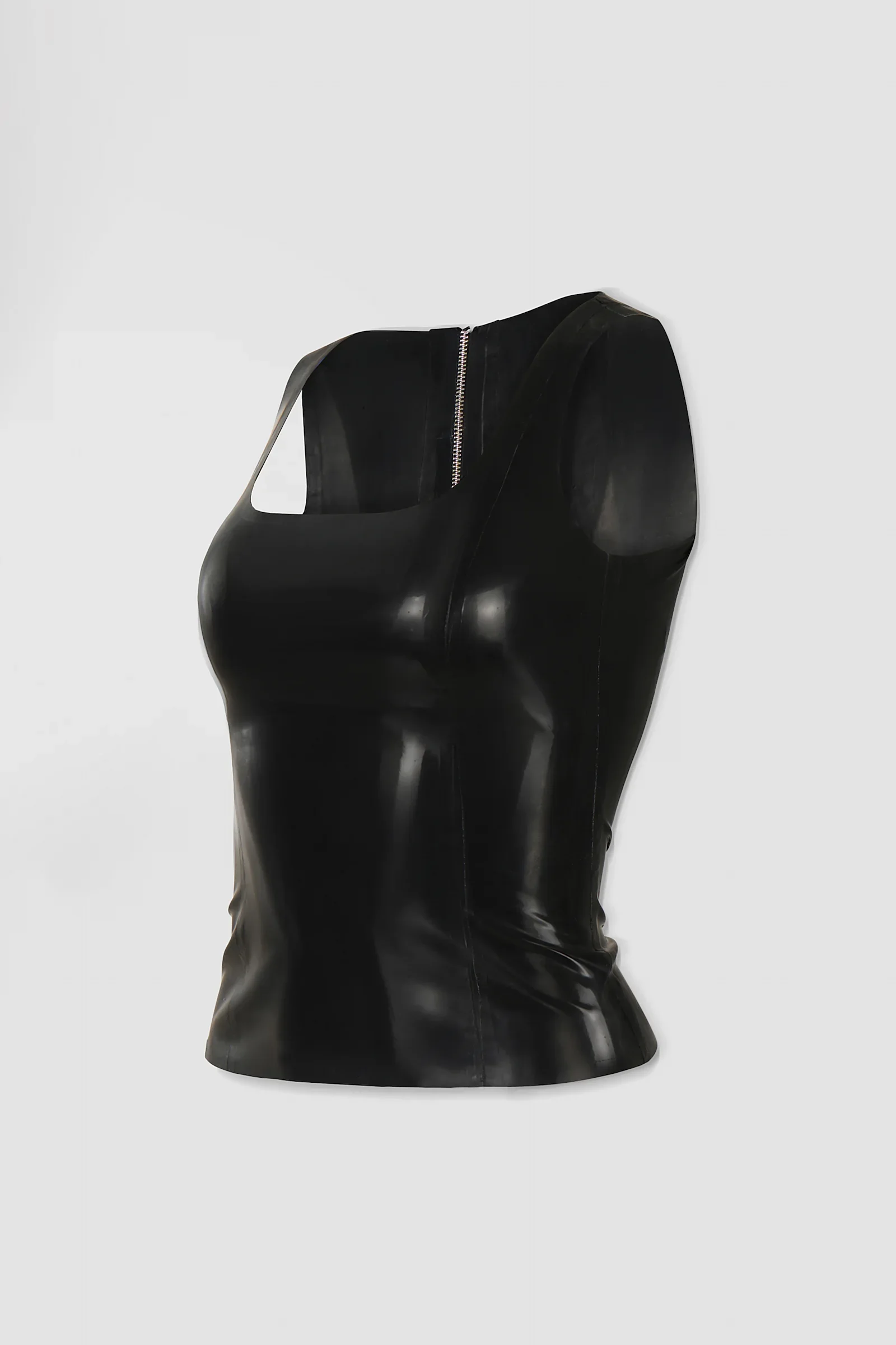 Side: Three-quarter view of the ‘Ophis’ latex tank top showing its fitted silhouette, contoured construction and short hem.