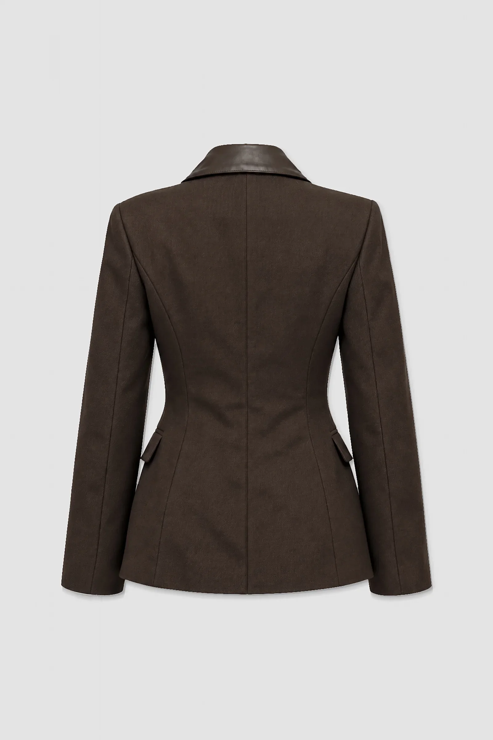 Three-quarter view of the Stheno chocolate brown tailored blazer showing structured shoulders, leather collar, notched lapels and fitted waist.