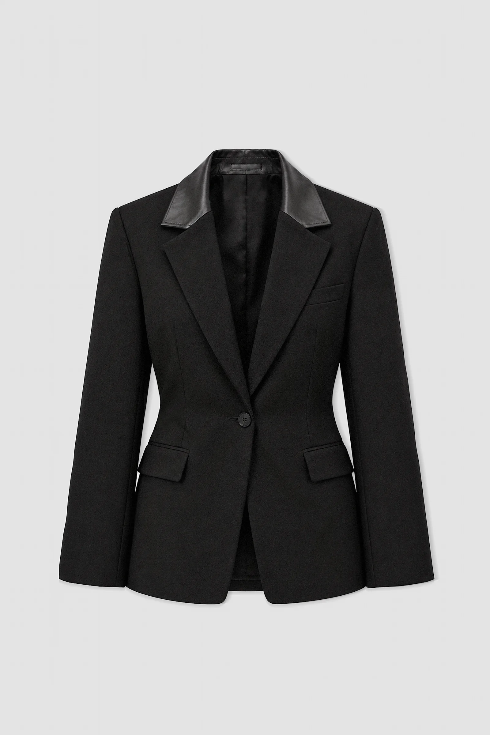Black tailored wool-blend blazer by ARAKHNE with contrasting Italian nappa leather collar, sculpted waist and single-button fastening.