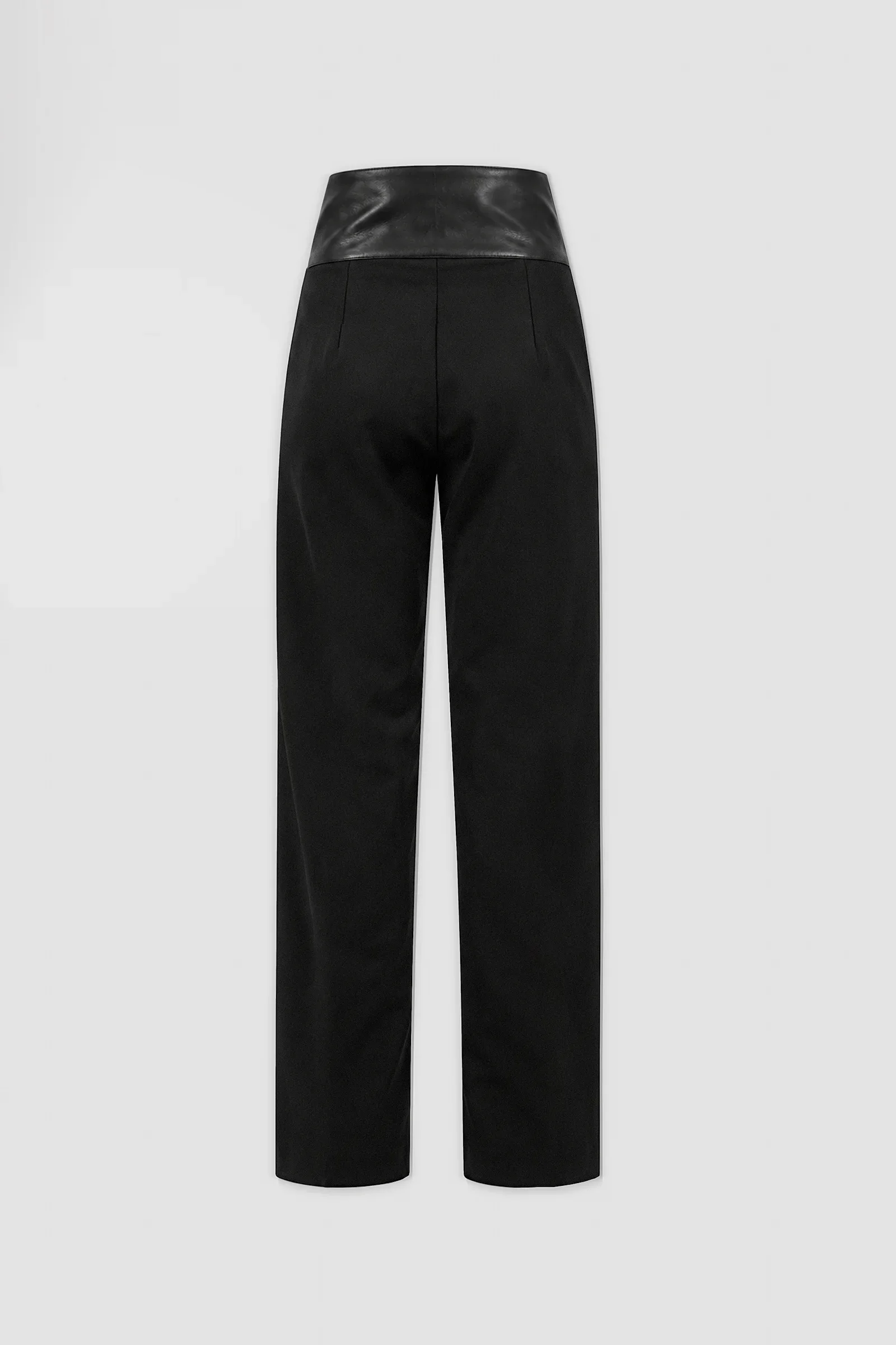 Back view of black straight-leg wool-blend trousers with a contrasting Italian nappa leather waistband and tailored rear darts.