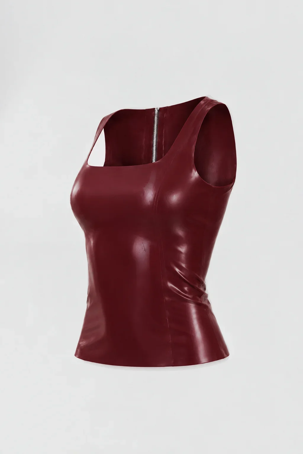Side: Three-quarter view of the ‘Ophis’ latex tank top showing its fitted silhouette, contoured construction and short hem.