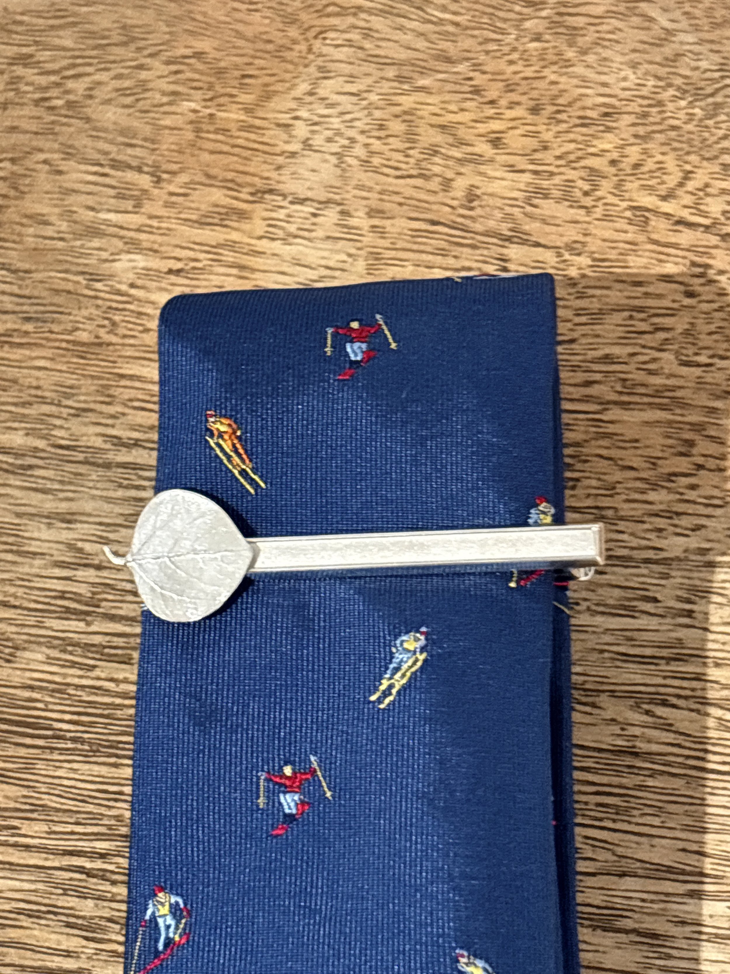 An Aspen Leaf tie clip on a tie at The Aspen Hive