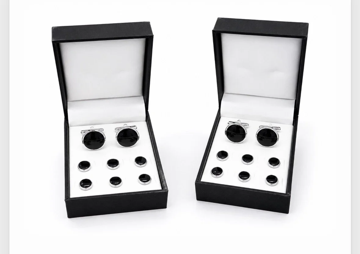 Cufflinks and tuxedo studs displayed in gift boxes at The Aspen Hive in Aspen