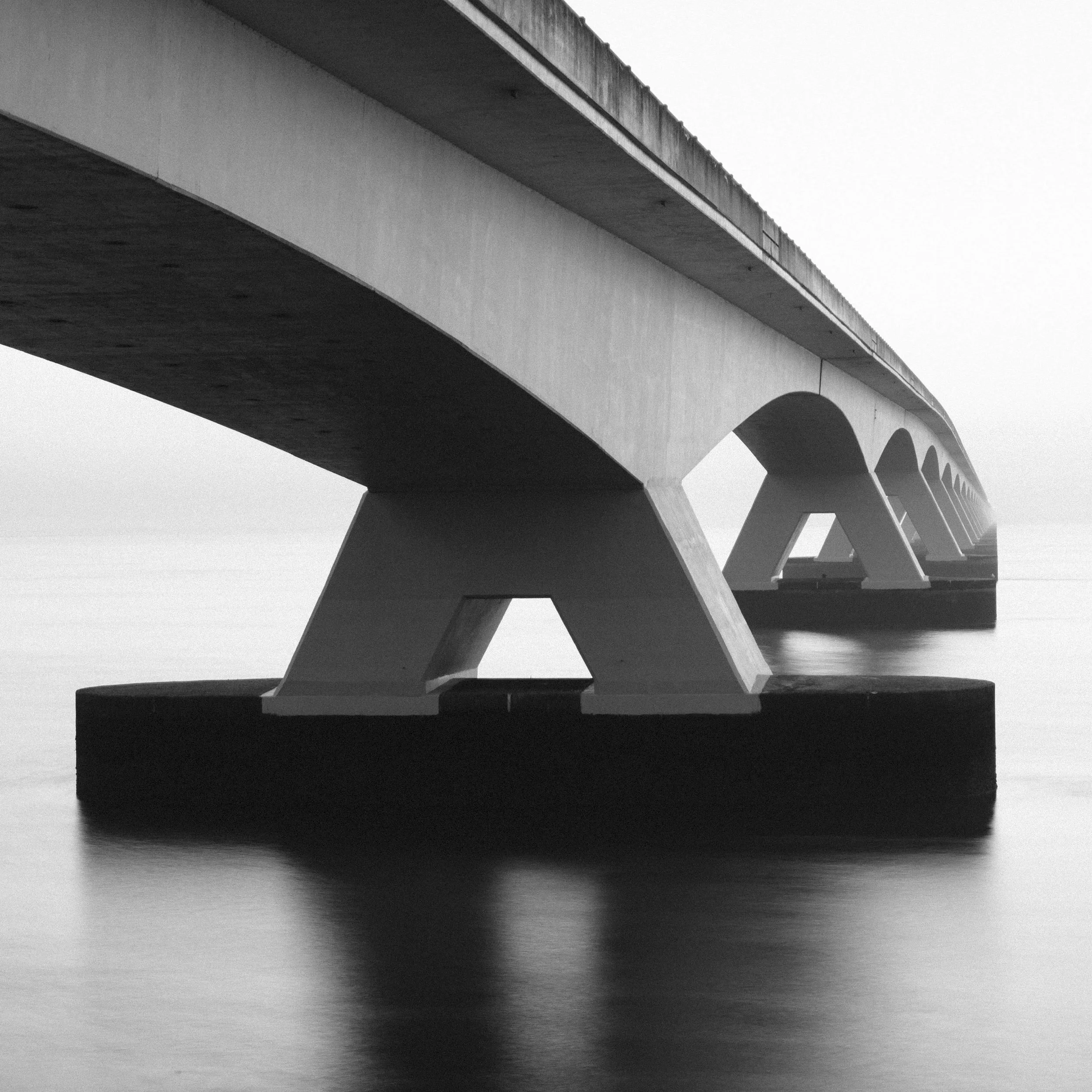 Grayscale image of a bridge