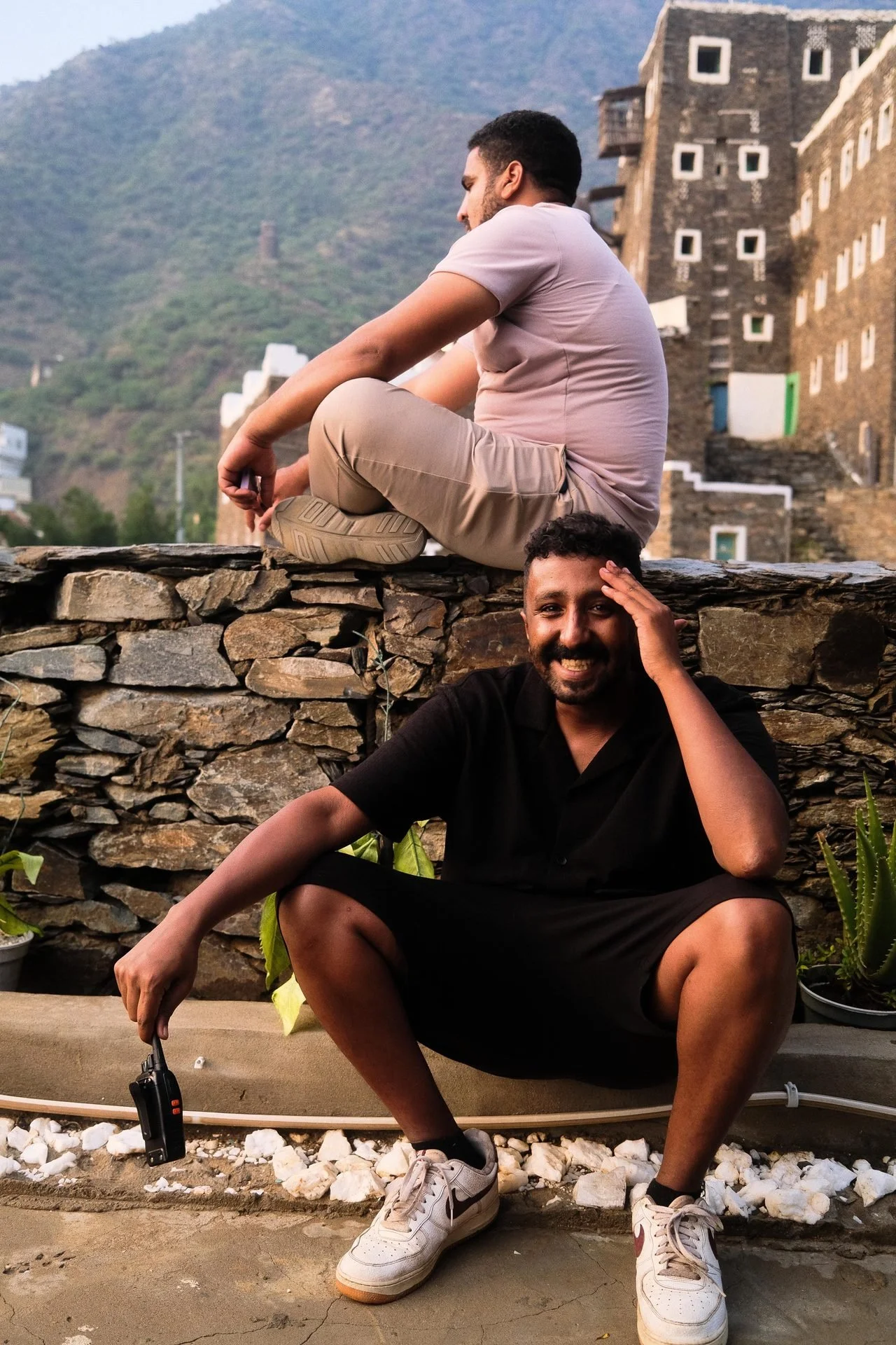 Saudi Film Fixers Crew members relaxing at Rijal Almaa heritage stone buildings during Evolving Cities