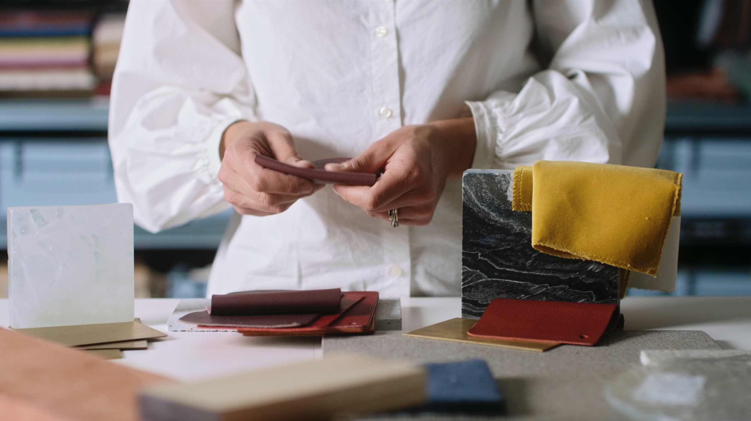 Material samples and textures explored on camera for a branded documentary architecture film, highlighting the tactile design process through mixed media.