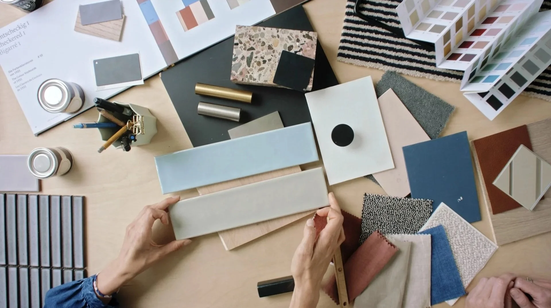 An architectural design workspace documented through mixed media, combining stills, video, and 16mm film for a branded development documentary.