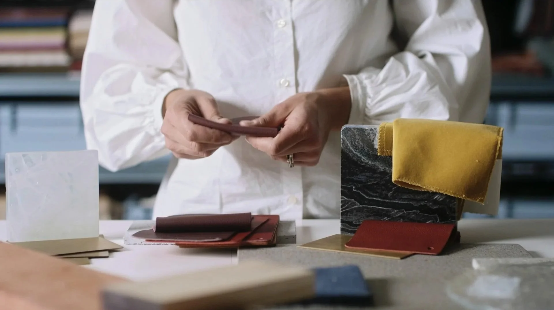 Material samples and textures explored on camera for a branded documentary architecture film, highlighting the tactile design process through mixed media.