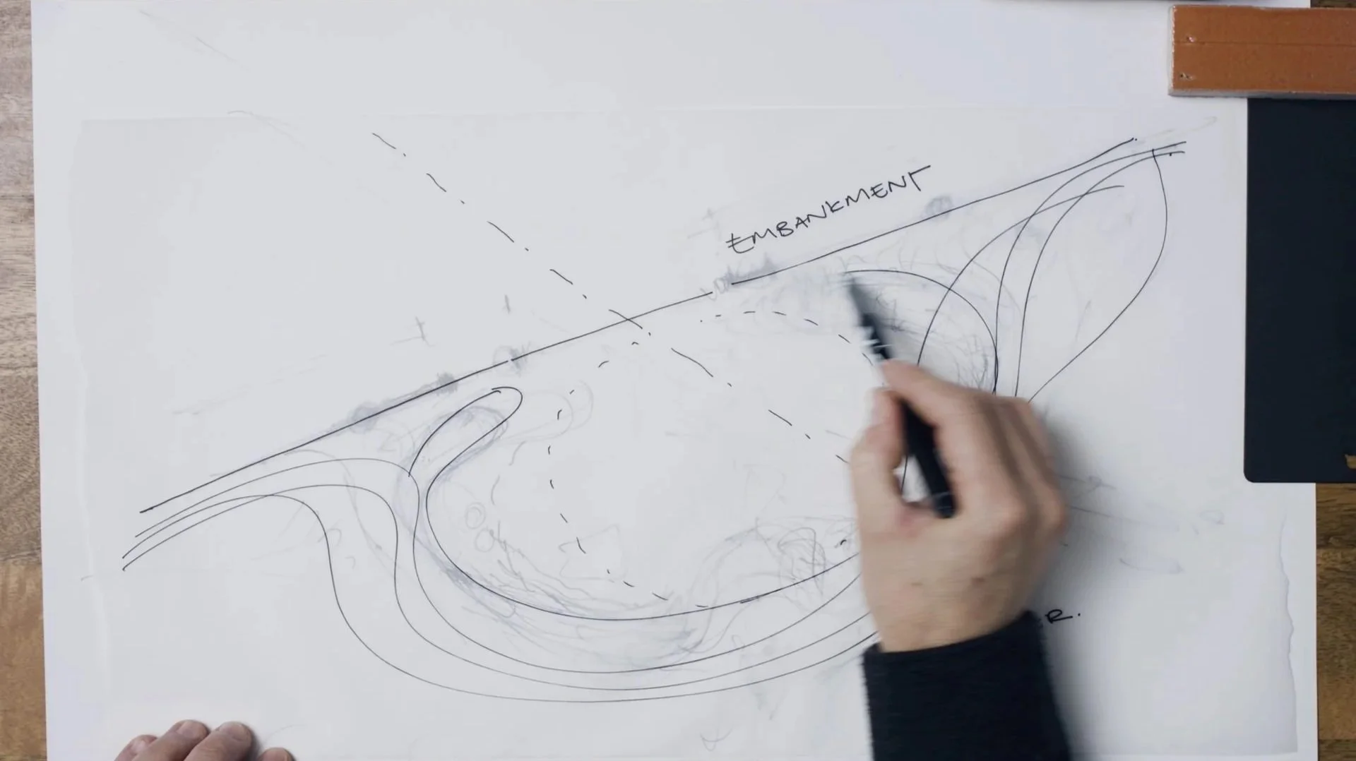 Hawkins/Brown architect sketching Thames Embankment site plan by hand
— design process captured in Thames Tideway architecture film