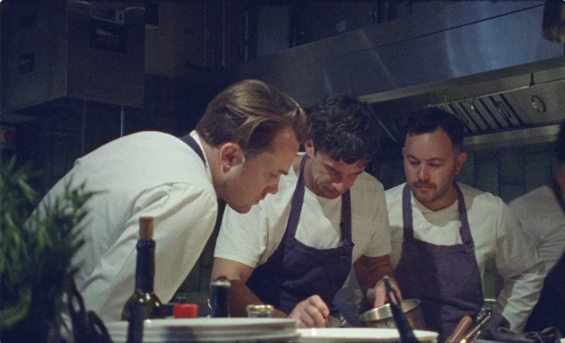Mountain and Le Doyenné chefs collaborating over dishes at kitchen pass, Soho
London, documentary film James Dougan