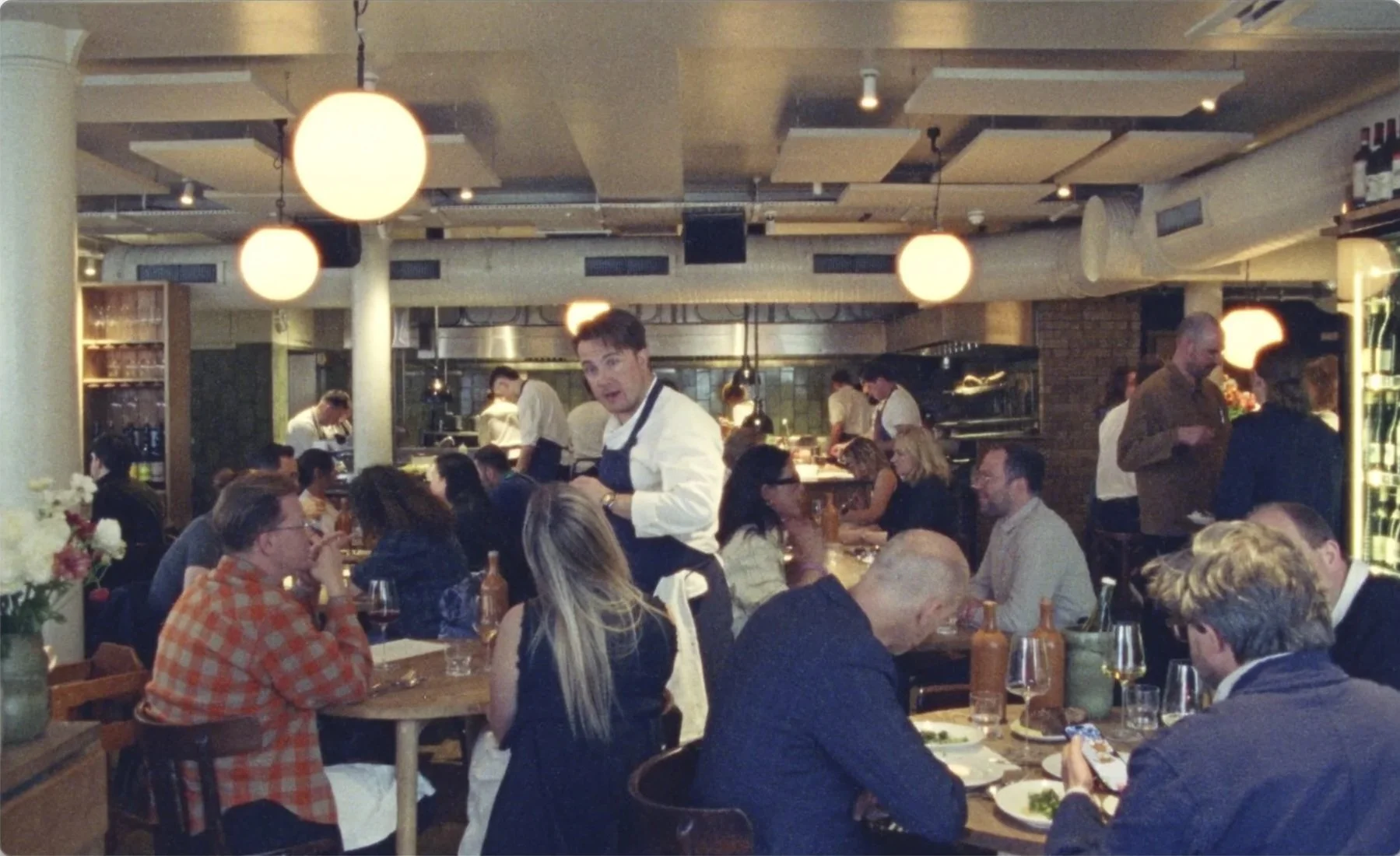 Mountain restaurant Soho full dining service with Tomos Parry, globe lights, Michelin
star restaurant, 16mm film James Dougan