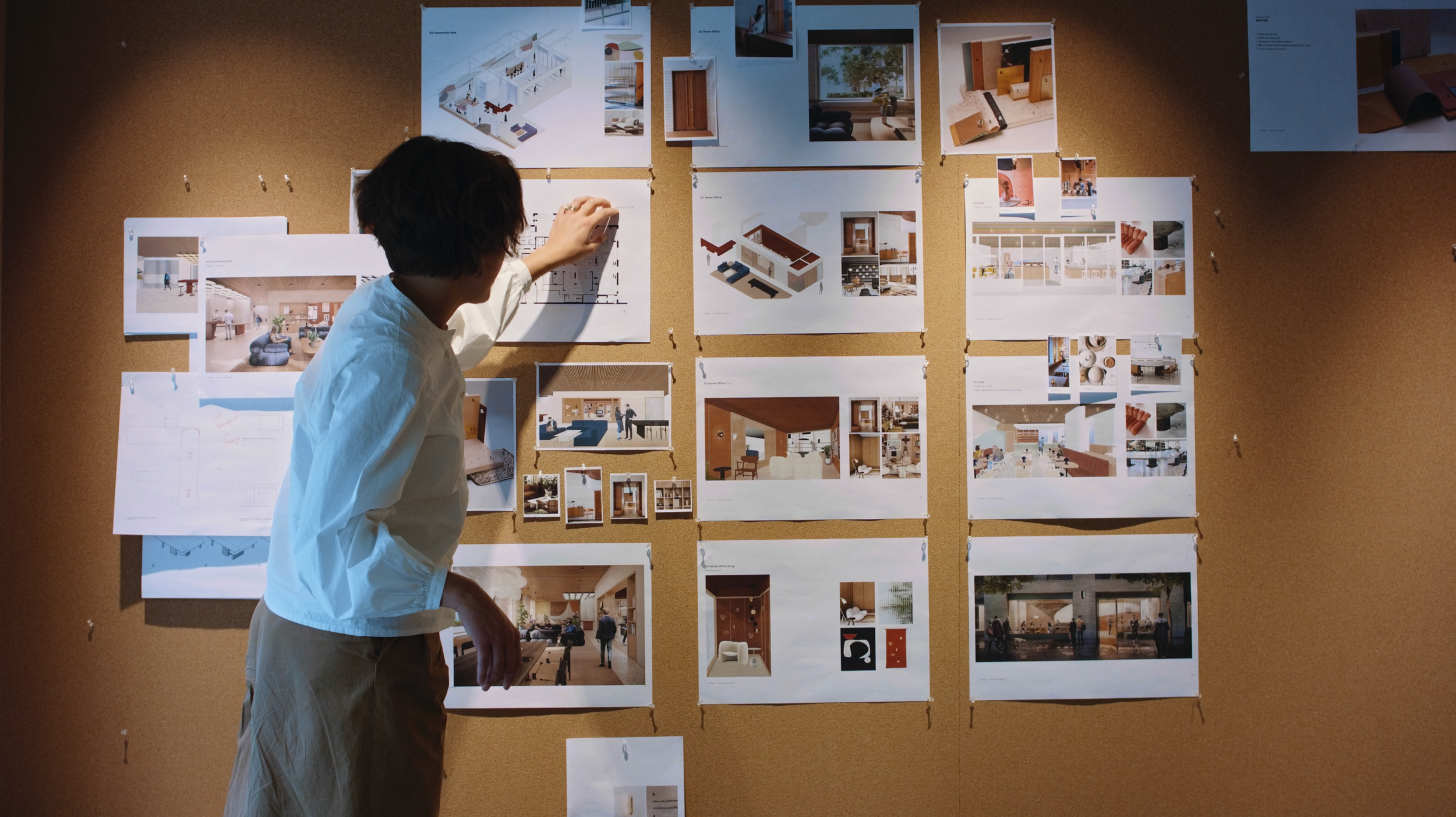 Architect reviewing plans, renders, and material studies during the development of Millharbour’s interior and communal spaces.