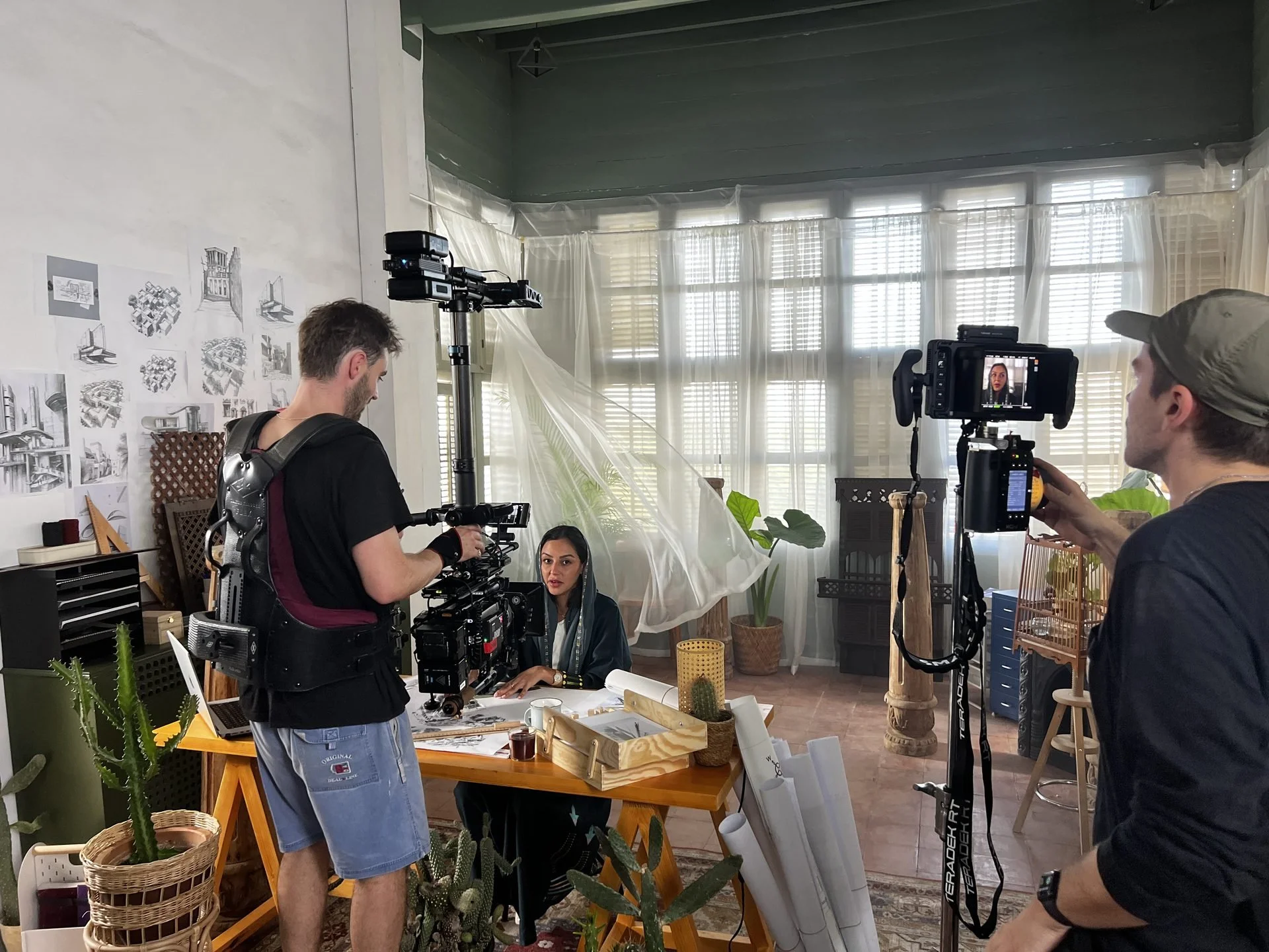 Steadicam crew filming artist in studio at Jeddah during Evolving Cities production