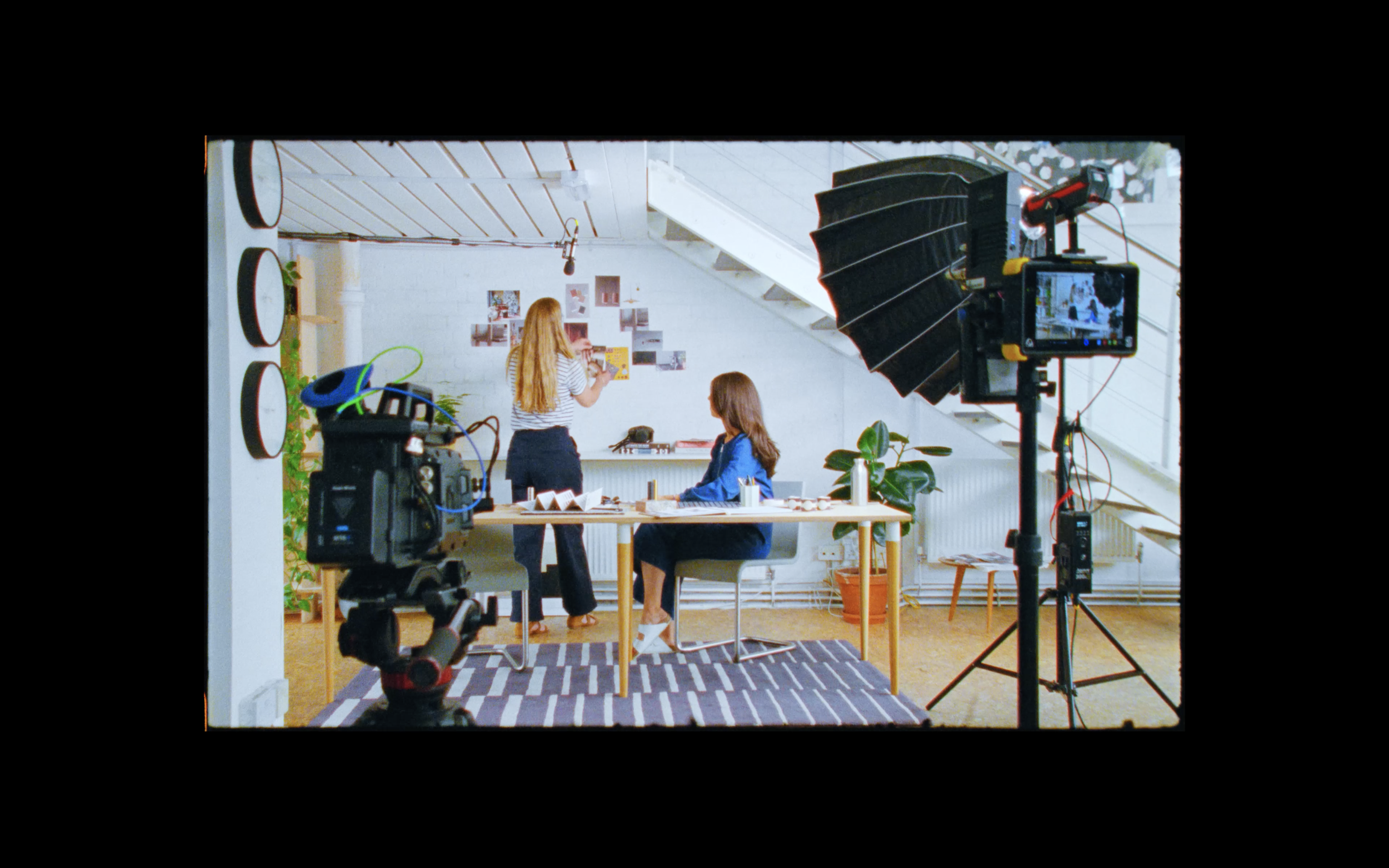 Behind the scenes of a branded documentary architecture shoot, combining interview setup, mixed media storytelling, and a cinematic 16mm film approach.