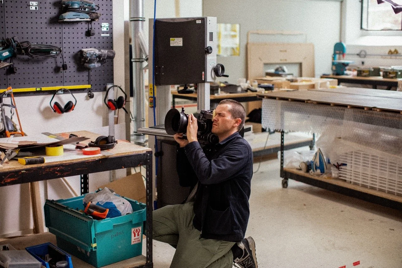 Filming material and craft details on location for a branded architectural development film, documenting the hands-on design and making process.