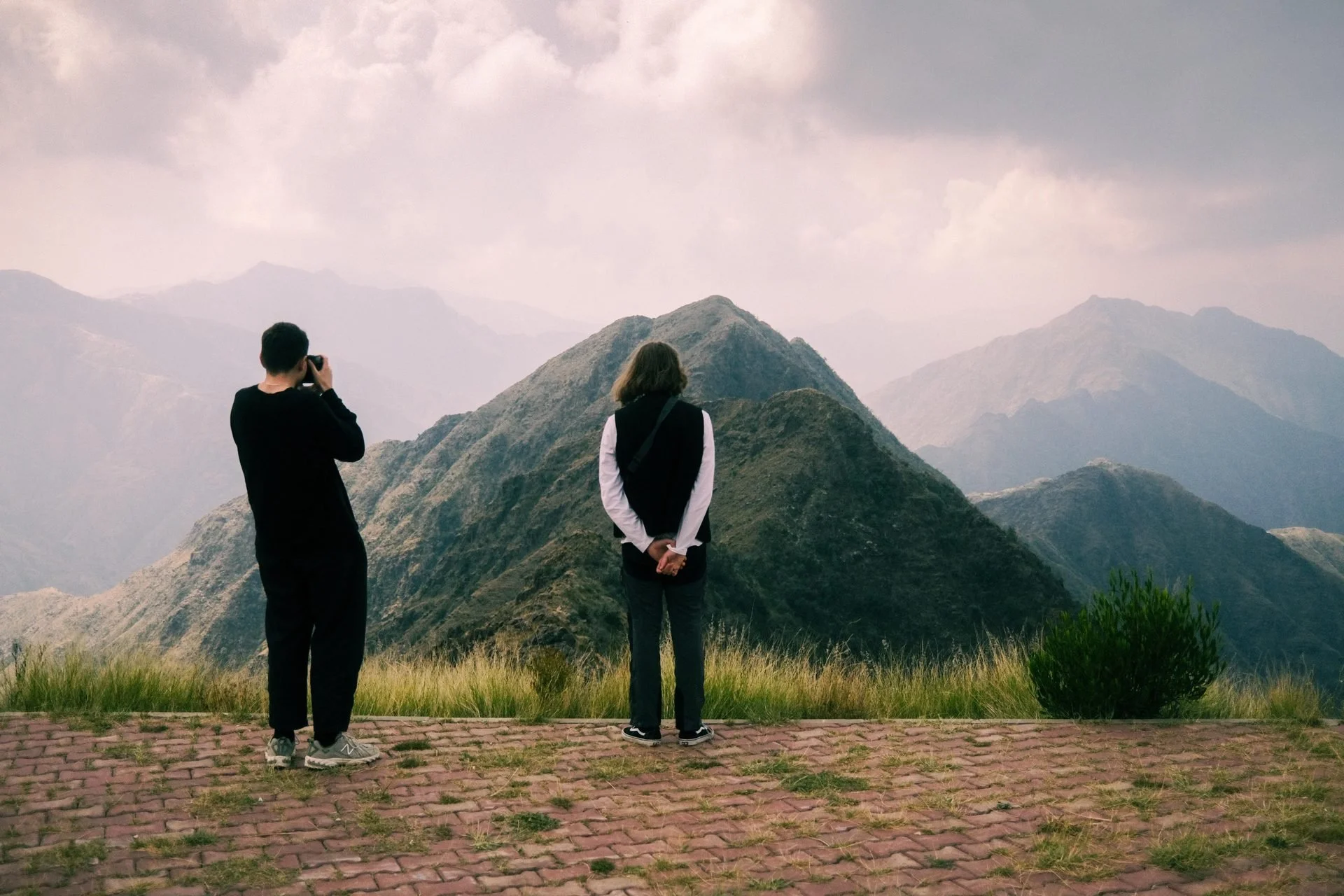 Film crew photographing at Asir mountains viewpoint during Evolving Cities location scout
