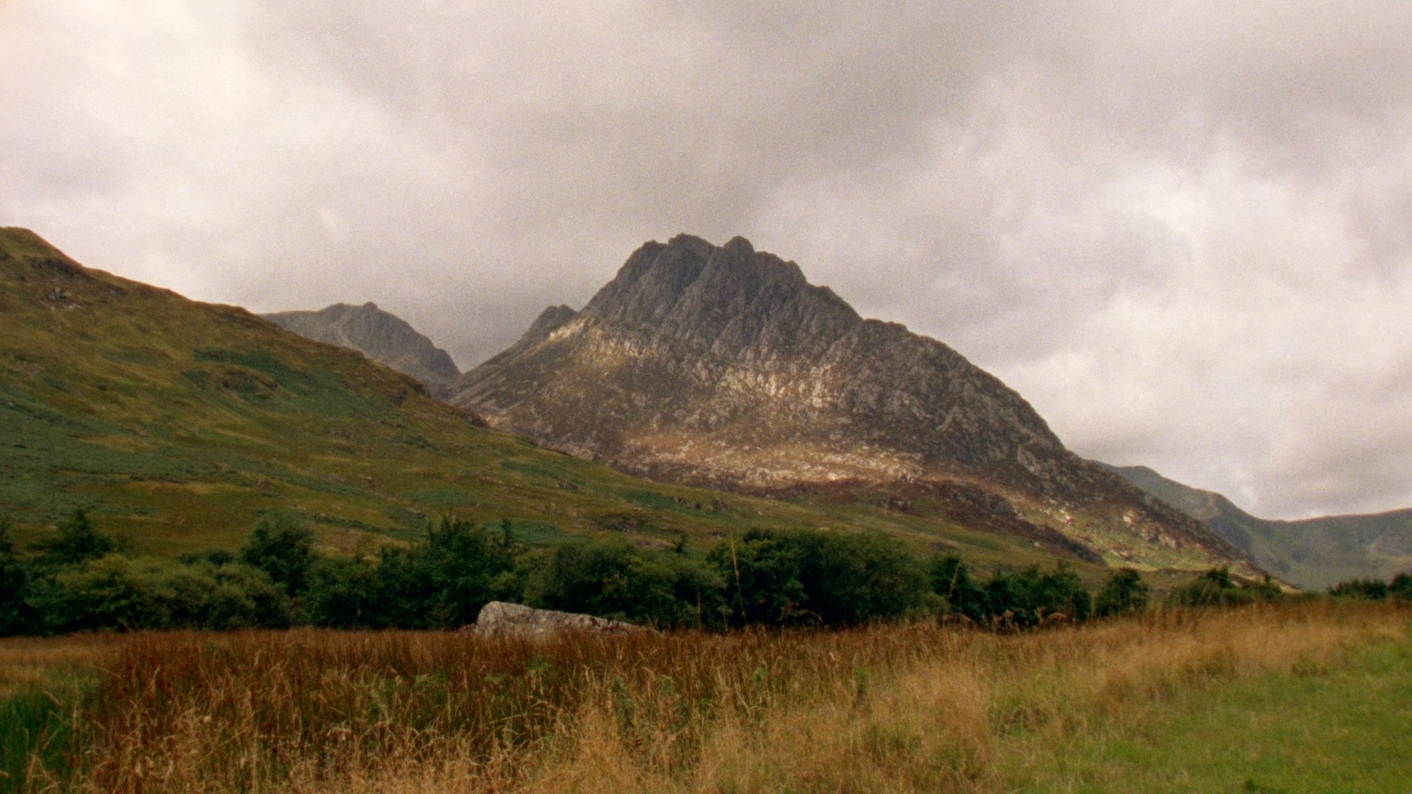 Wide landscape of rugged Snowdonia mountain filmed on 16mm film for a documentary.