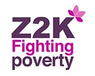 Z2K Fighting Poverty logo with purple and pink text and a flower symbol