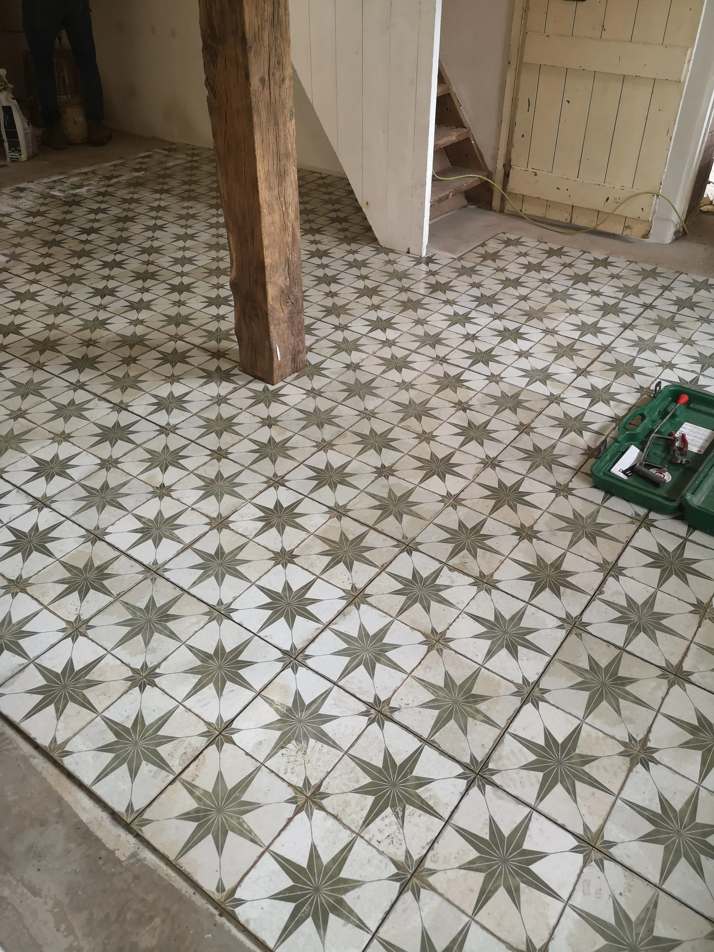 A lovely vintage tile laid in a farm cottage
