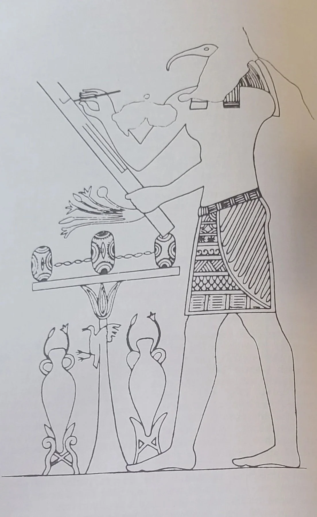 Fig 66 The god Thoth, with an ibis head, writing on a palette