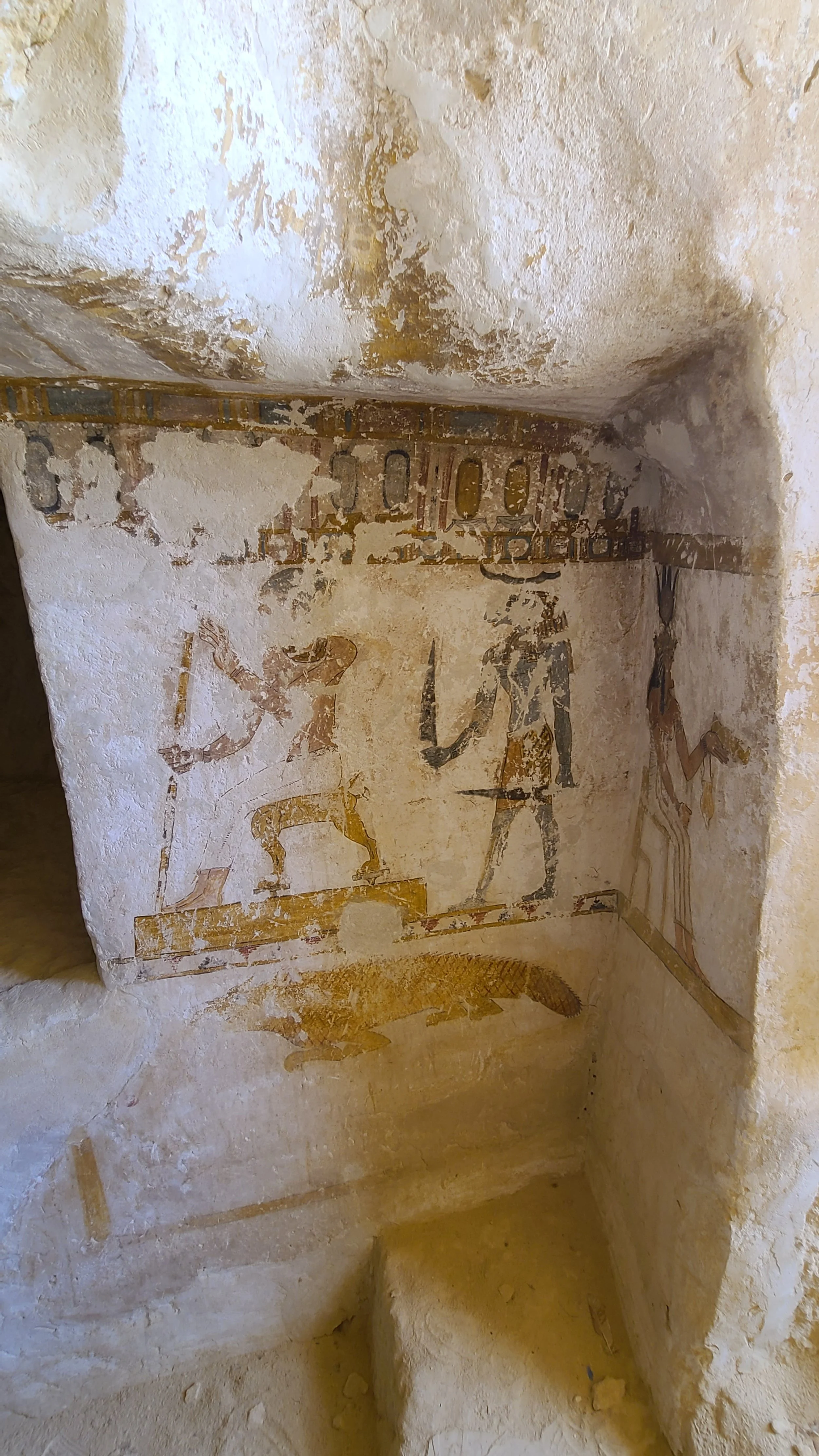 The seated tomb owner, Amun behind, Crocodile below