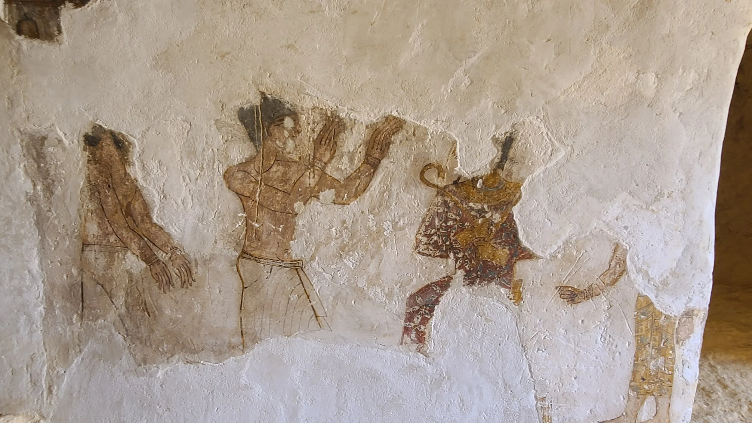 The tomb owner worshipping Osiris, seated, Isis behind