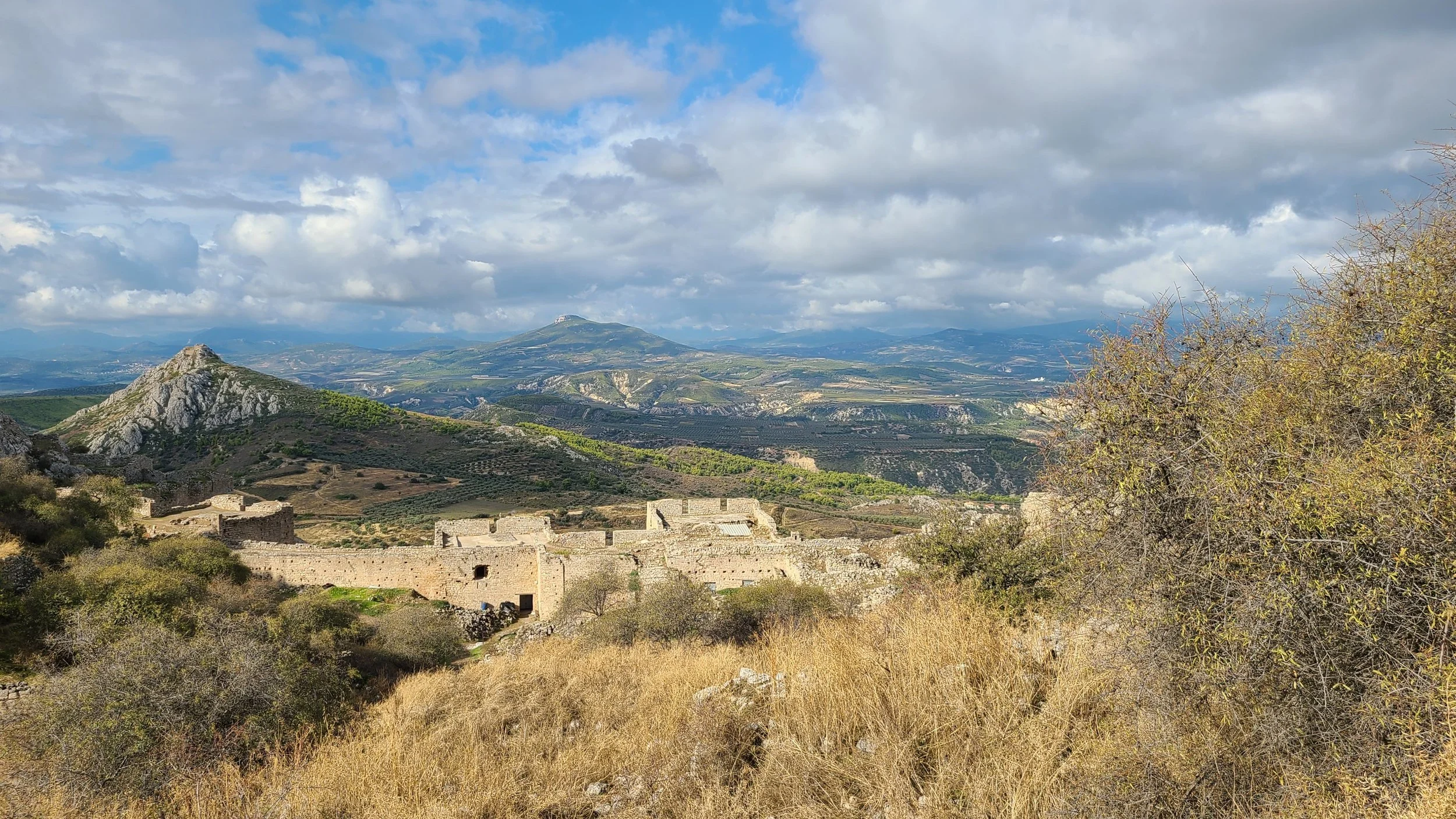 Southwest view and part of the wall; Penteskoufi Castle on the peak to the left