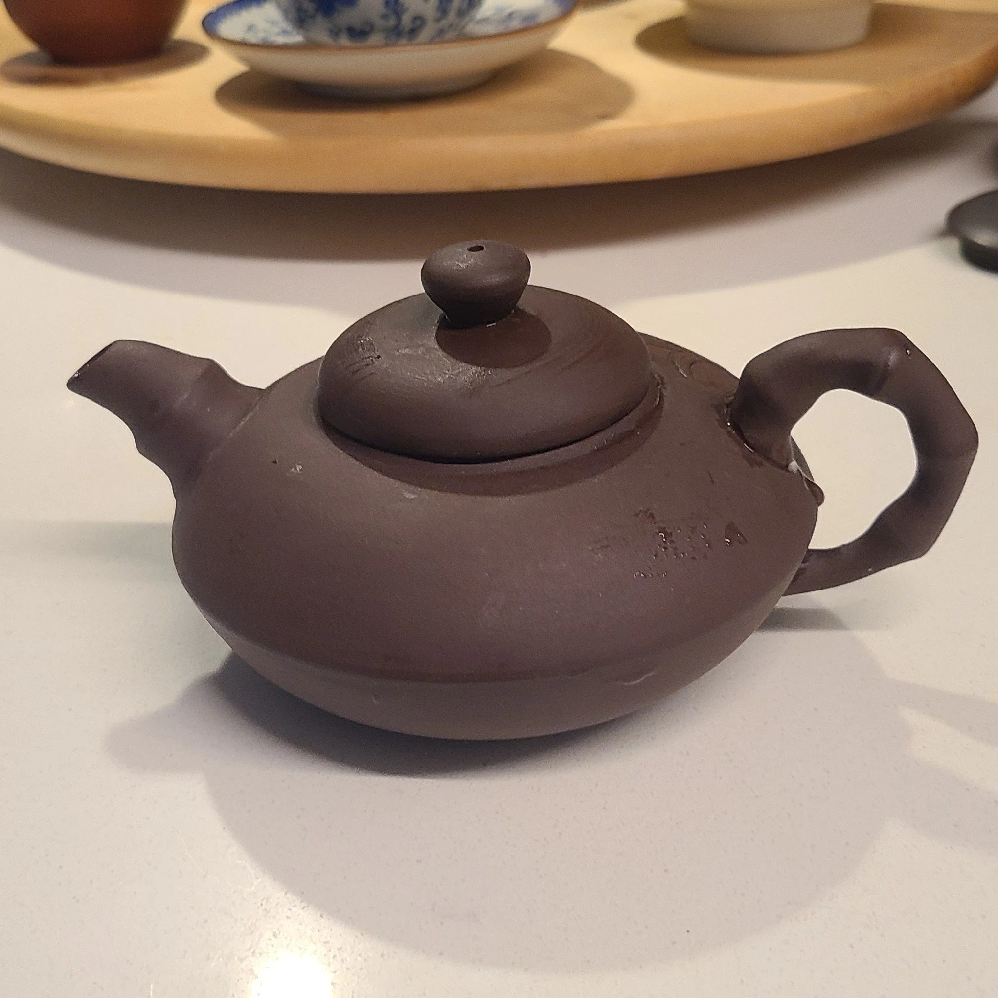 medium brown, oblong, bamboo handle and design