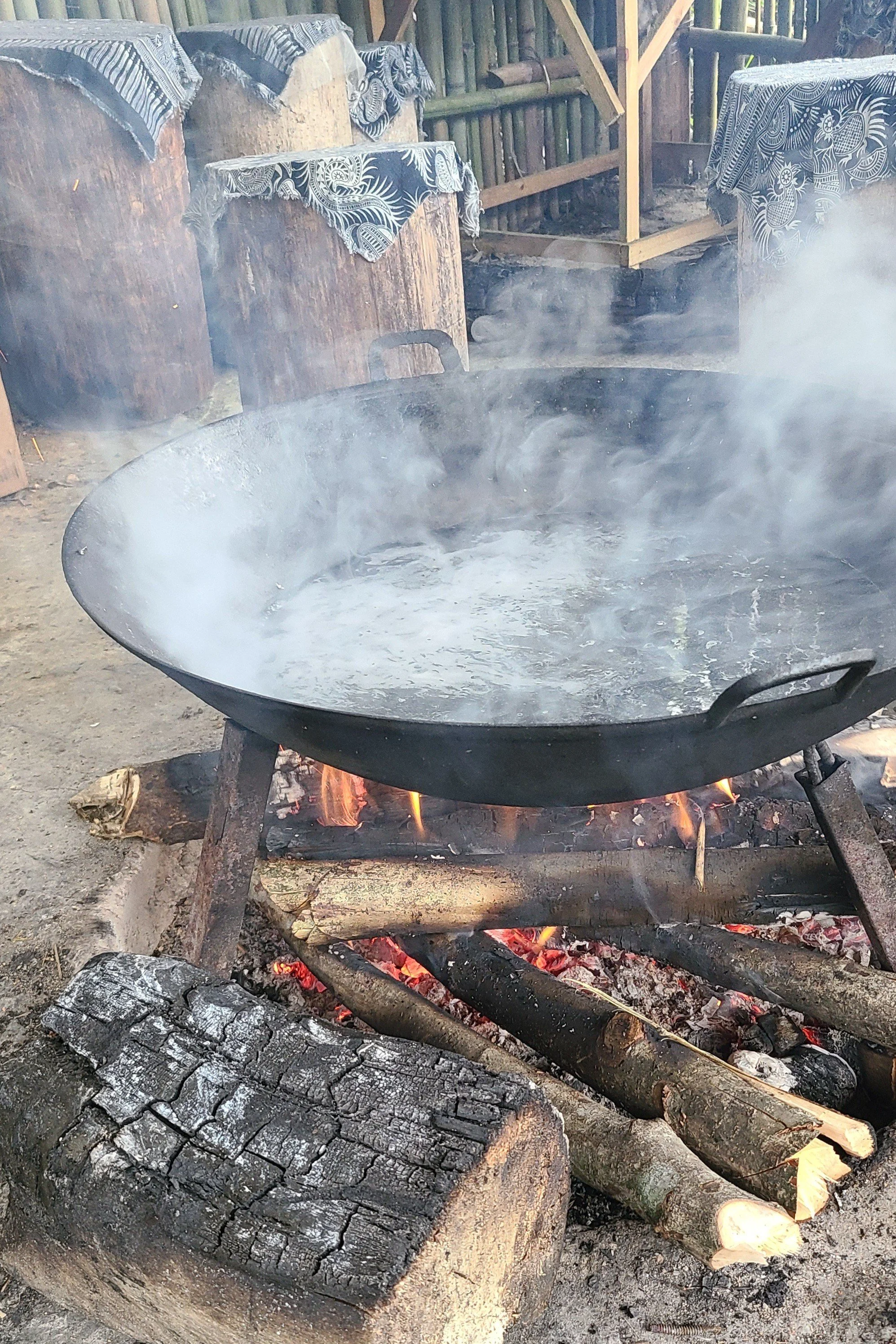 Preparing breakfast over an open fire