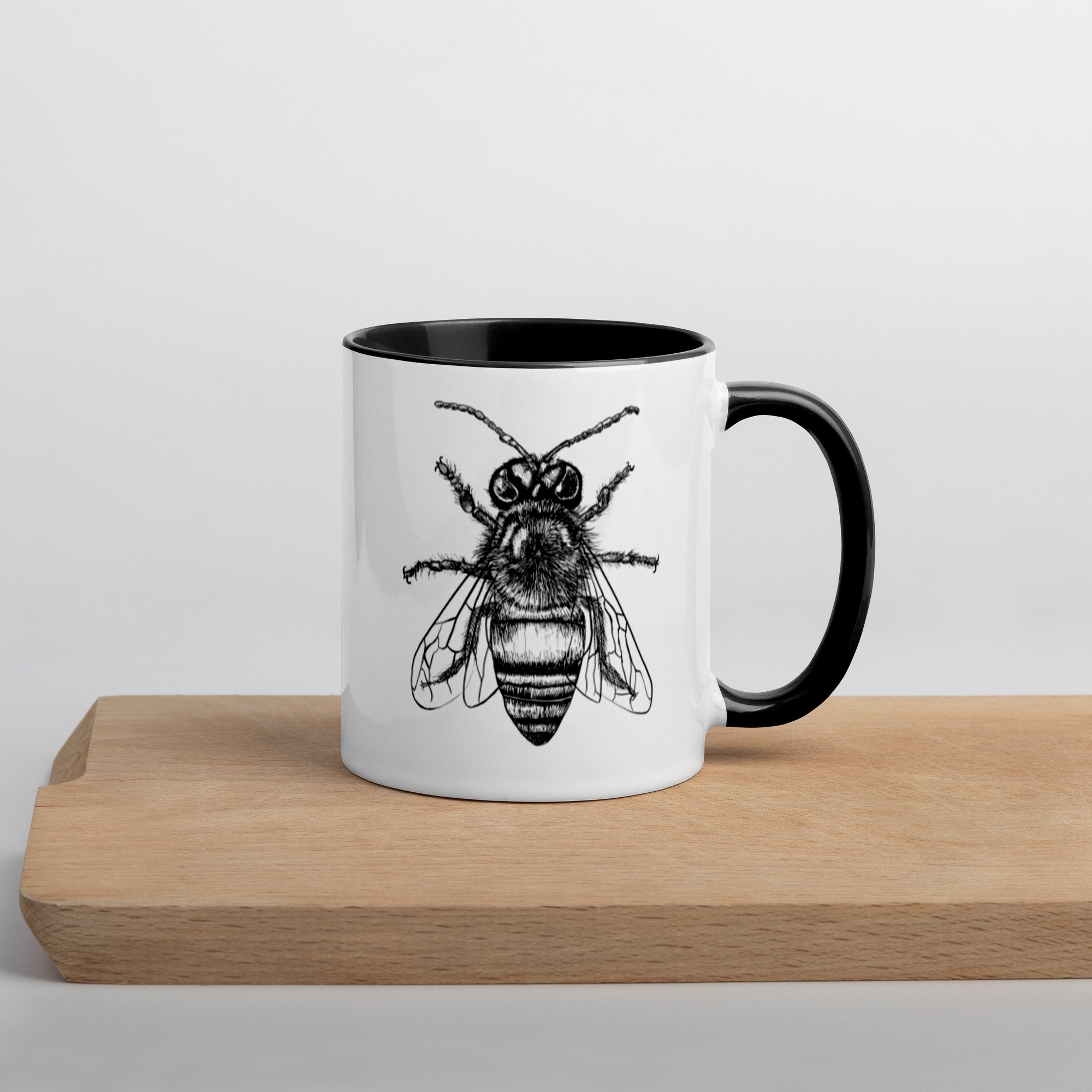 white-ceramic-mug-with-color-inside-black-11oz-right-63052e079d1e8.jpg
