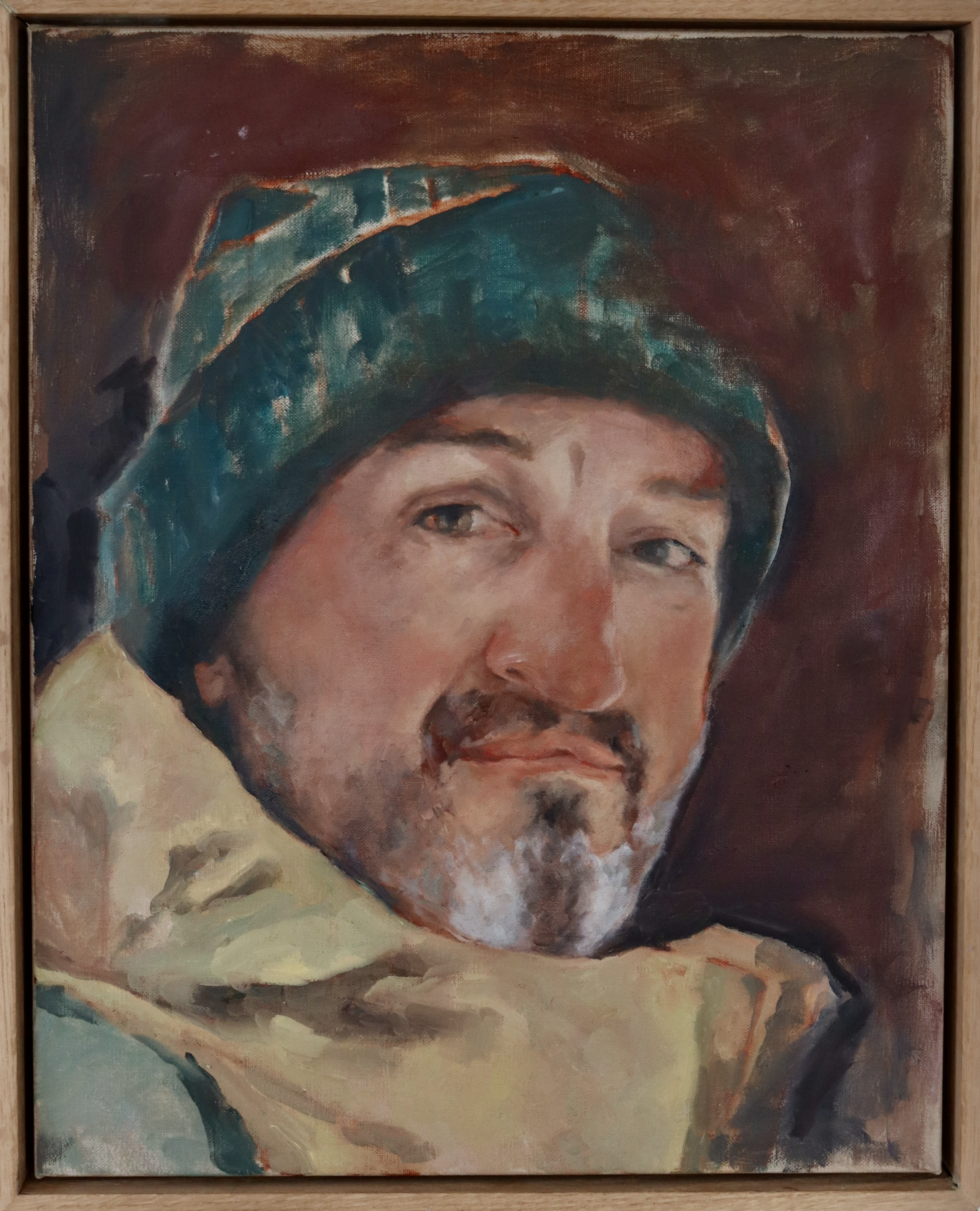 Close-up of a painted portrait focusing on the person's face, depicted with expressive brush strokes. The portrait shows a person with a mustache and beard, wearing a headscarf. The background is dark brown with earthy tones, and the person is dressed in clothing with shades of beige and gray.