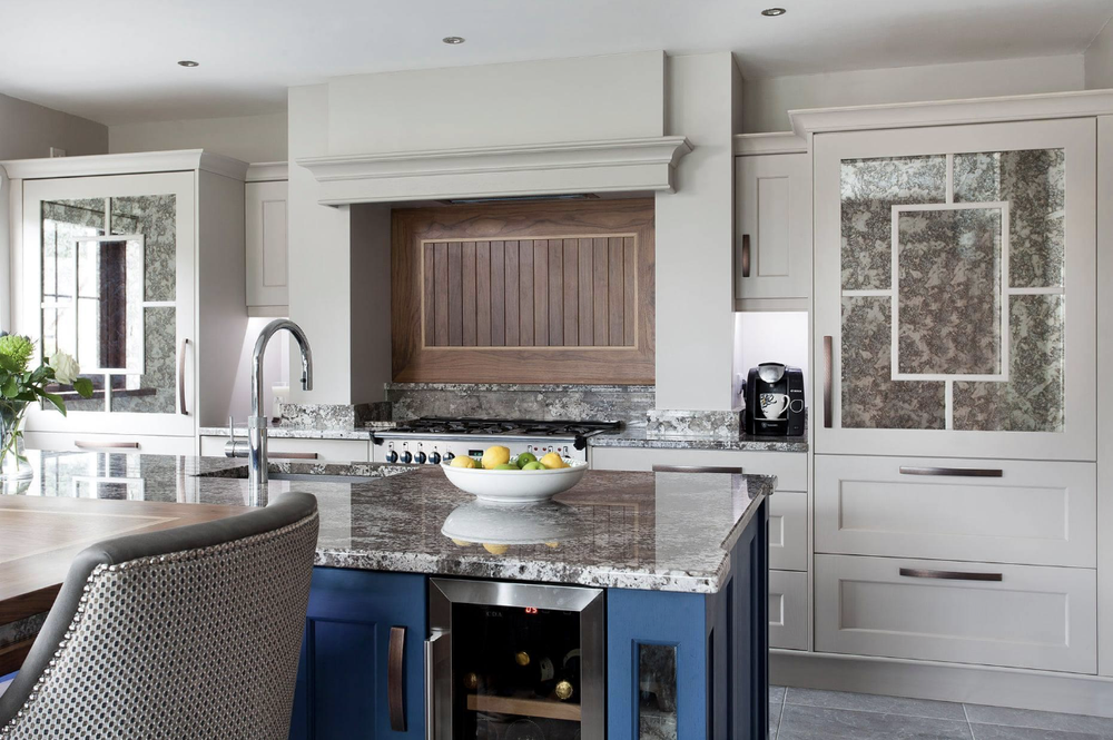 Mantle feature with a Walnut backsplash and Oak Inlay, Rangemaster range and solid Quartz worktops including upstands and sill feature
