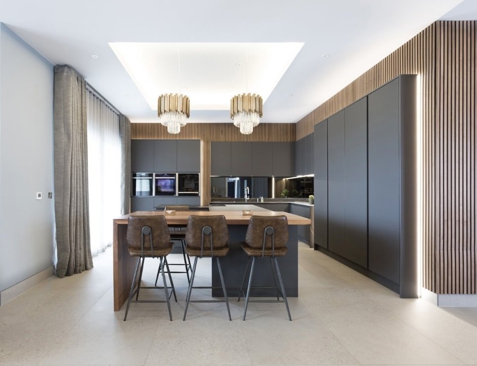 Modern Handless kitchen finished in Matt Graphite, Solid Dekton worktops, mirror back-splash, acoustic wall paneling