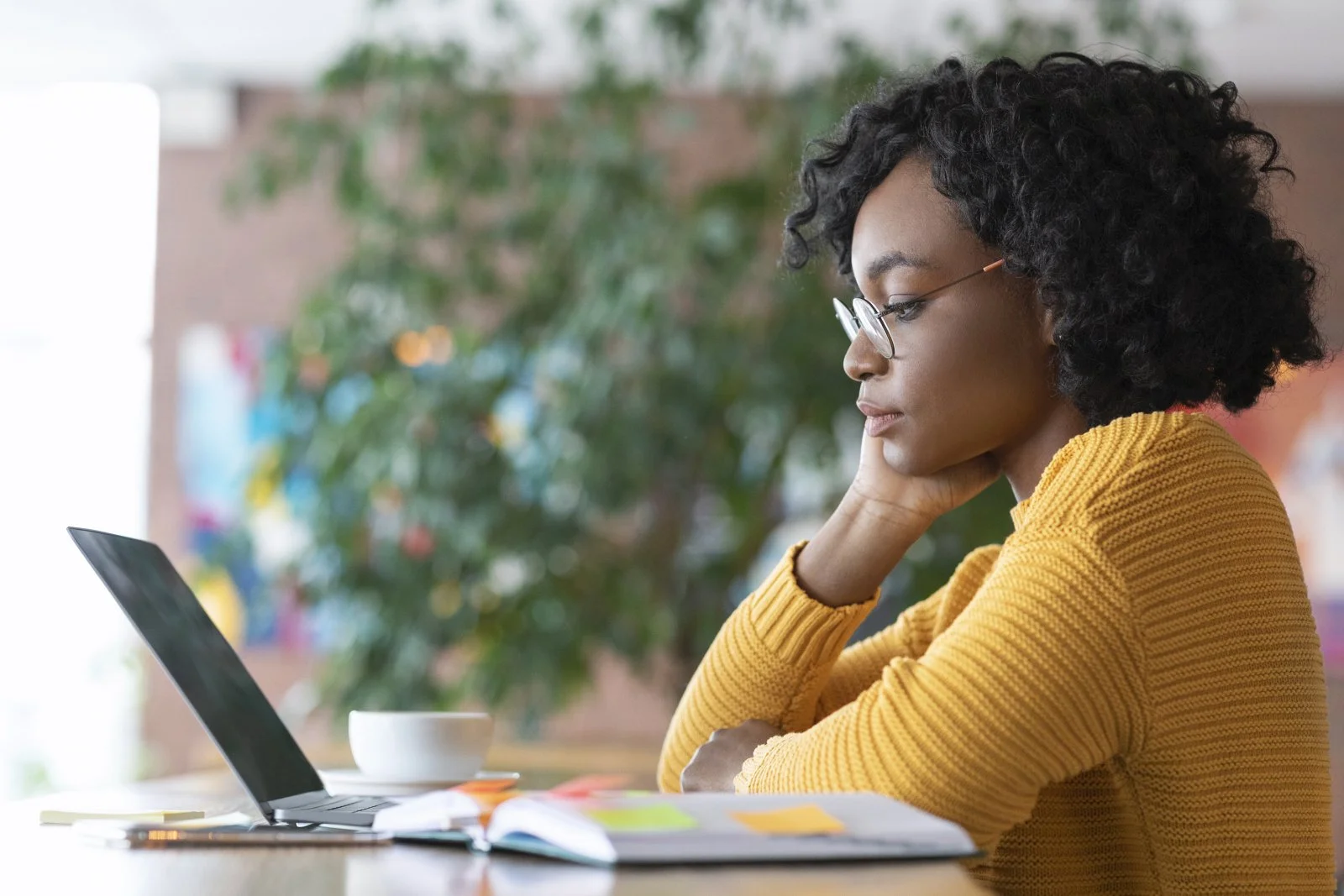 Minority Femaie Studying on Computer