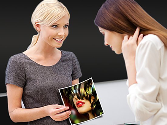Two women looking over photo prints during a free print consultation
