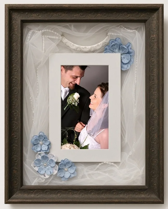 Wedding shadow box with a veil, beaded headband, flowers and a wedding photo, built by The Frame Gallery