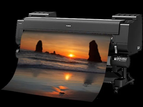 Canon large-format printer printing a sunset photo on canvas