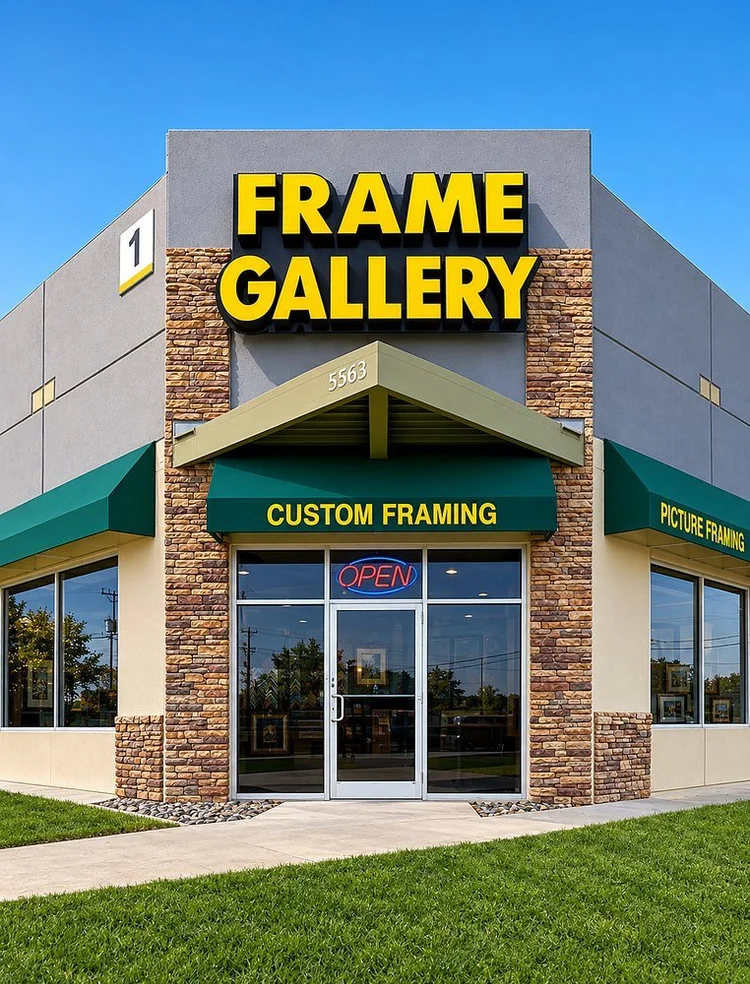 The Frame Gallery storefront at 5563 De Zavala Rd in San Antonio, with a yellow sign and green Custom Framing and Picture Framing awnings