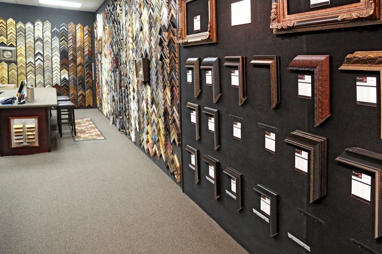 Wall of frame corner samples and the design counter inside The Frame Gallery in San Antonio