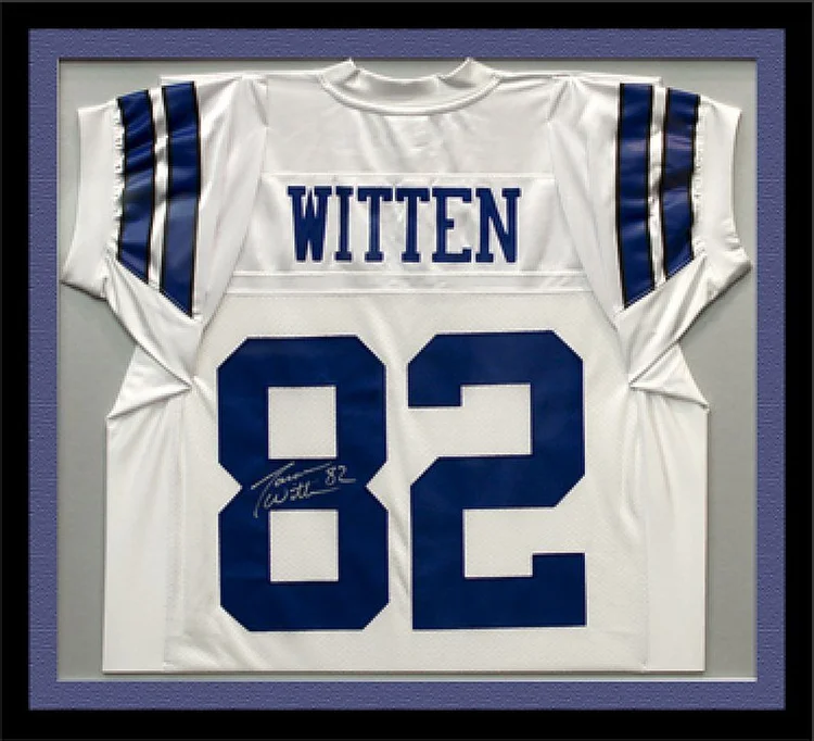 Signed white number 82 football jersey in a black shadow box frame with a blue mat, framed by The Frame Gallery