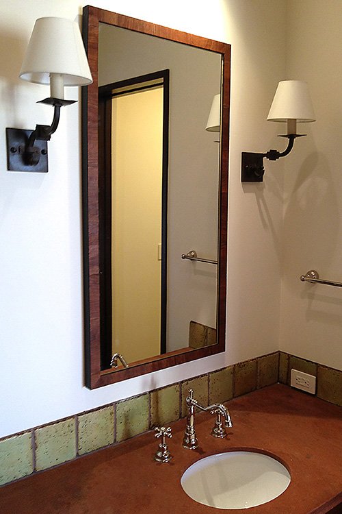 Natural wood framed bathroom mirror
