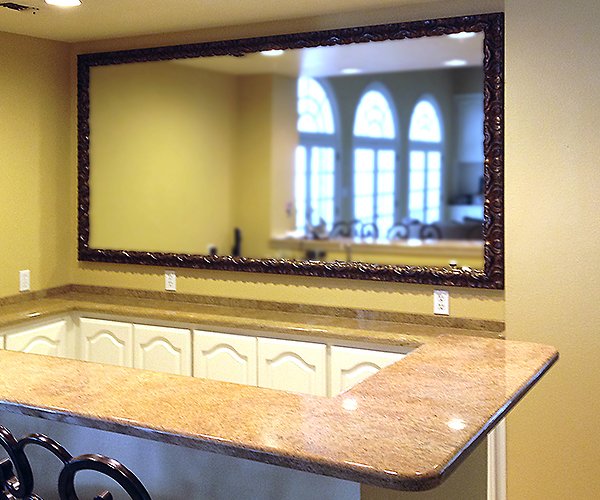 Very large ornate bar framed mirror.