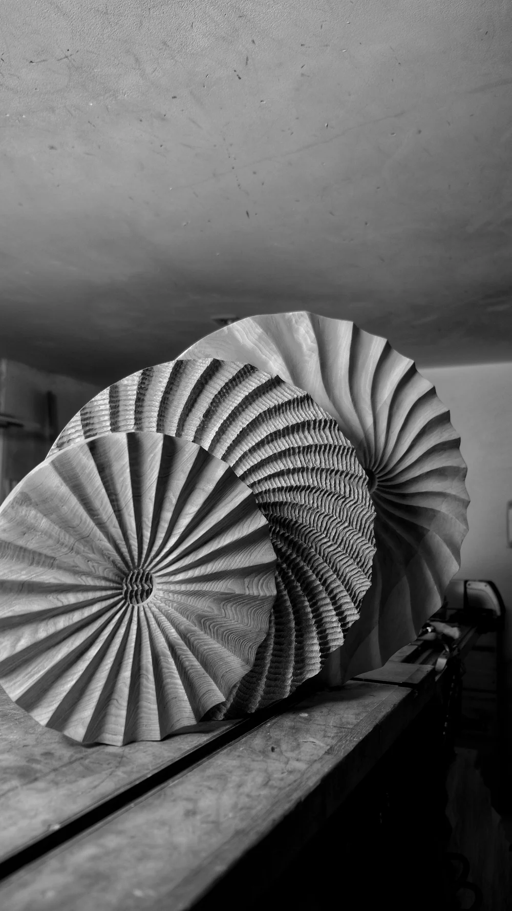Close-up of a fluted wood sculpture by Pavan Patel