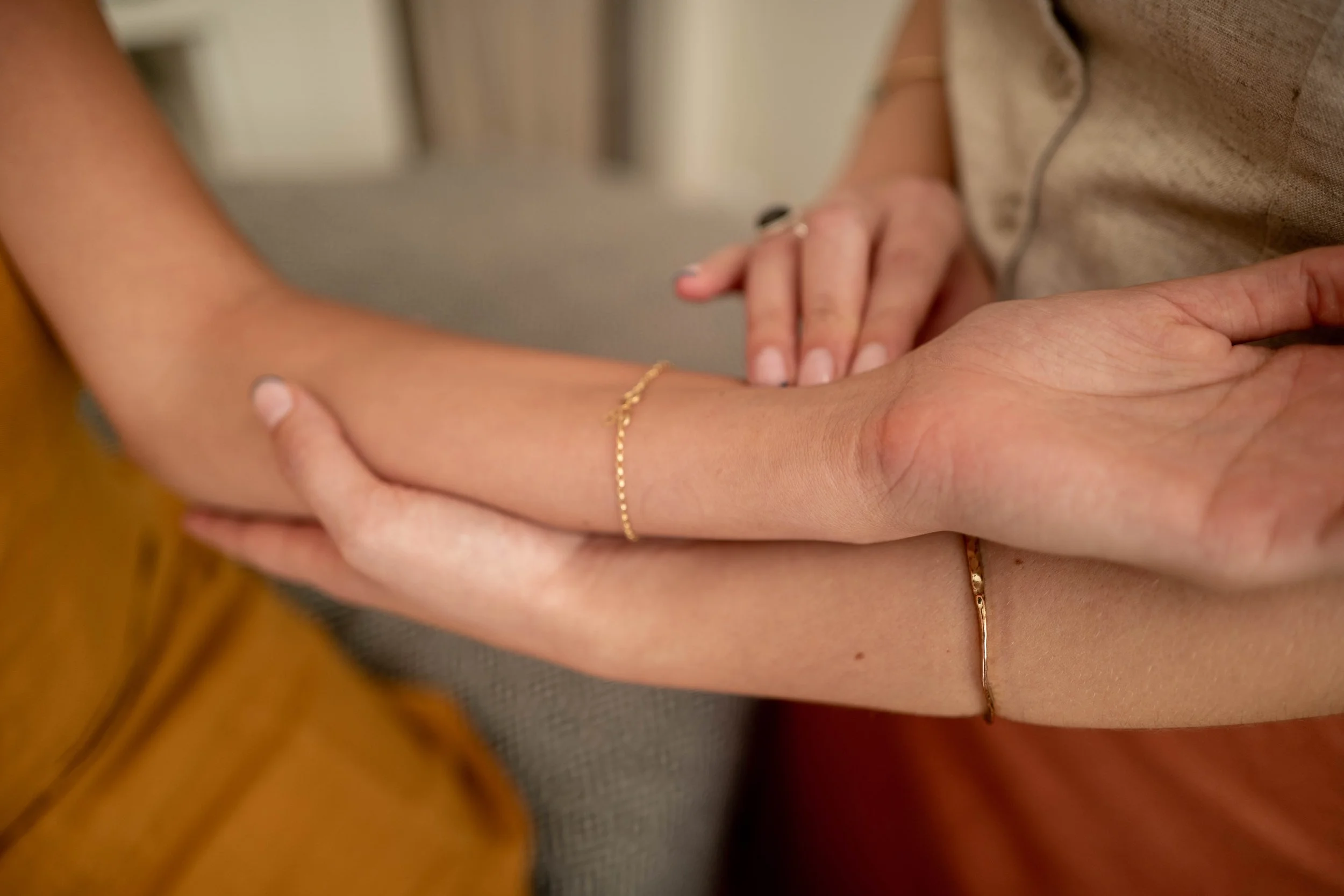 Licensed acupuncturist performs pulse diagnosis on female patient at Ritual House in Los Angeles