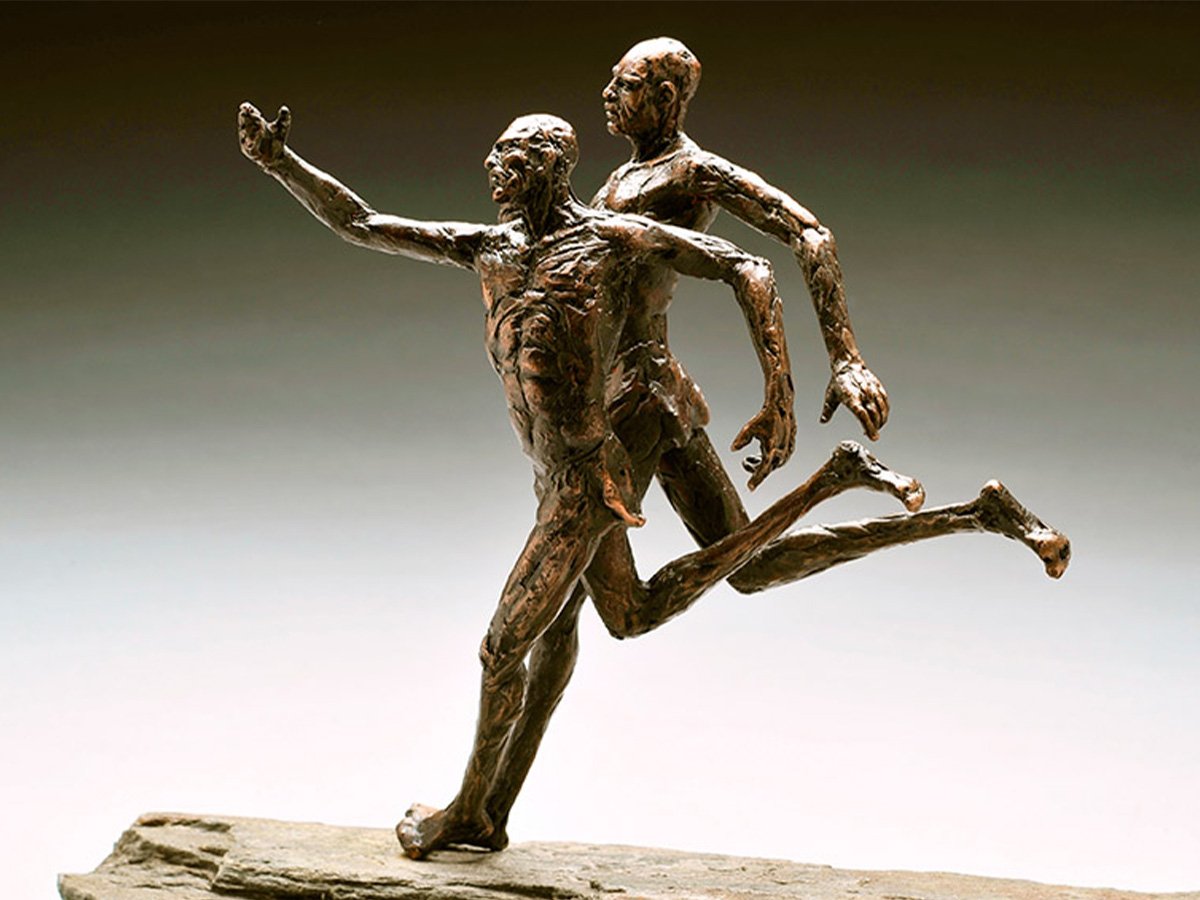 bronze sculpture of elongated runners