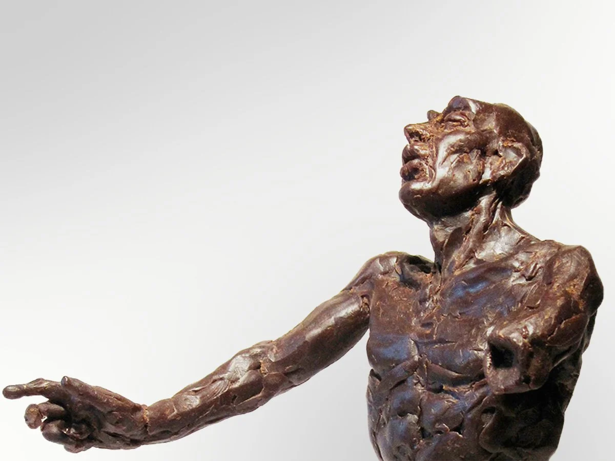 wax figure reaching out and squinting